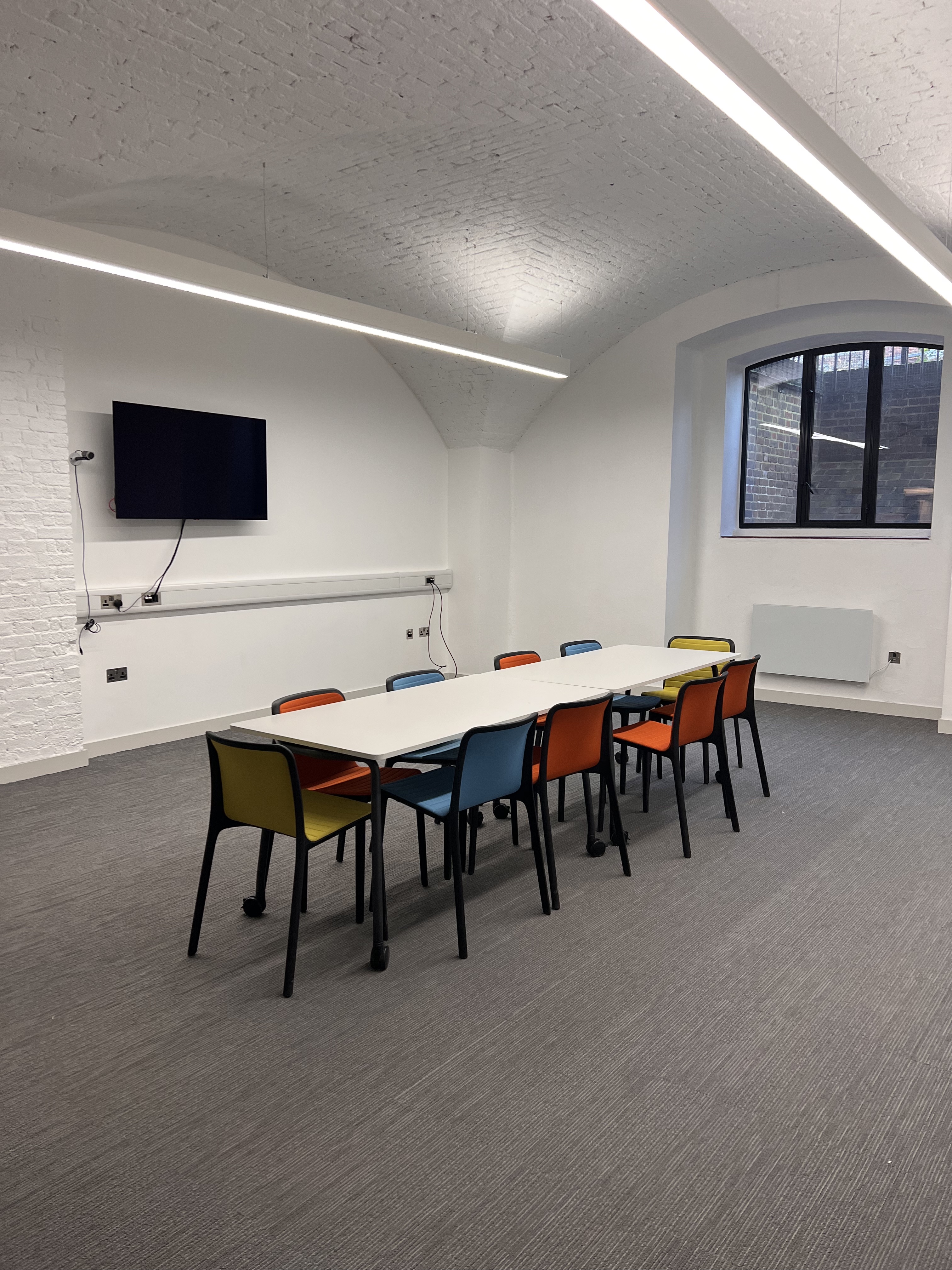 Modern meeting room in St John's Church Waterloo with AV setup for workshops and presentations.