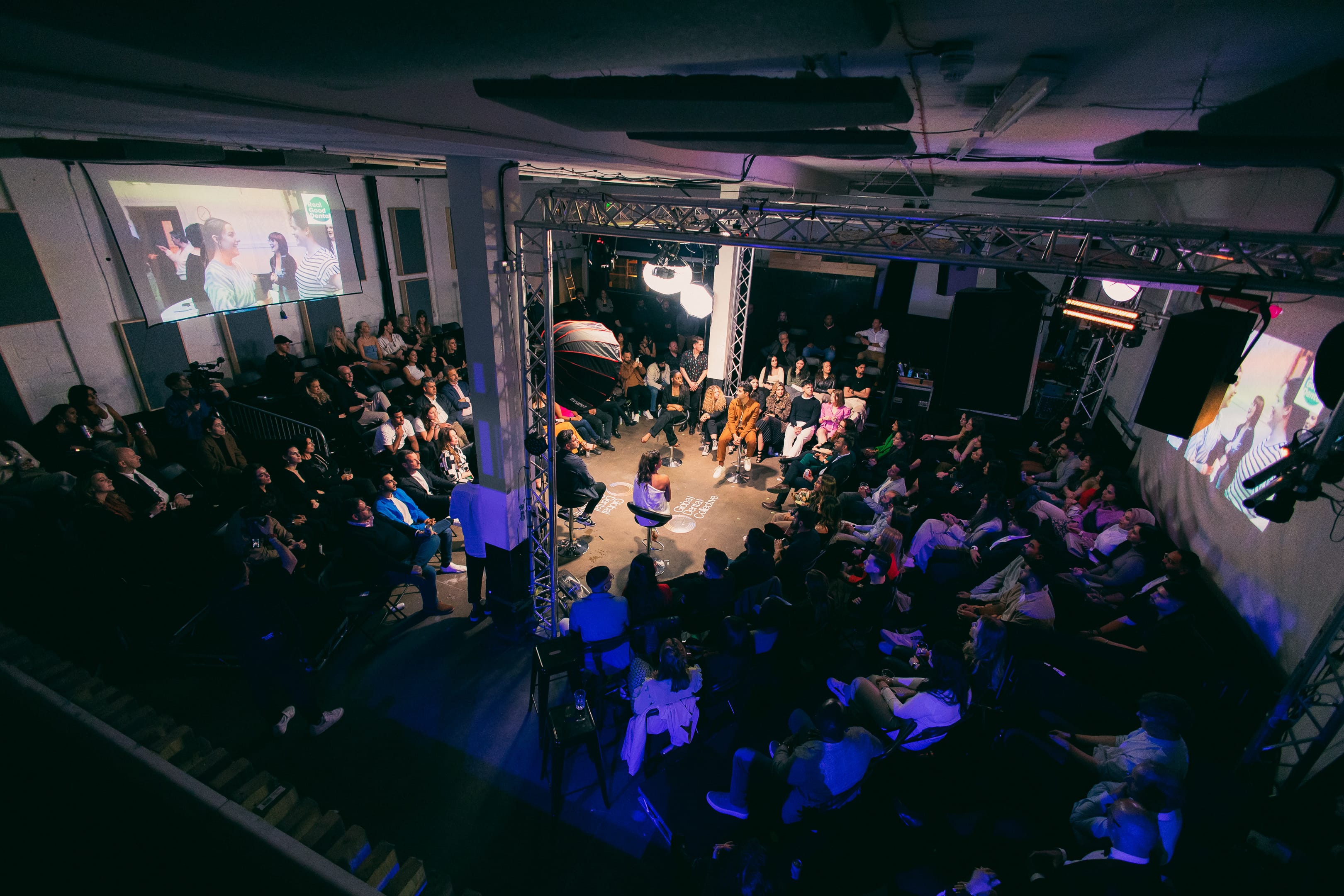 Dynamic event space at 90 Live in Studio 9294 with engaged audience and screens.