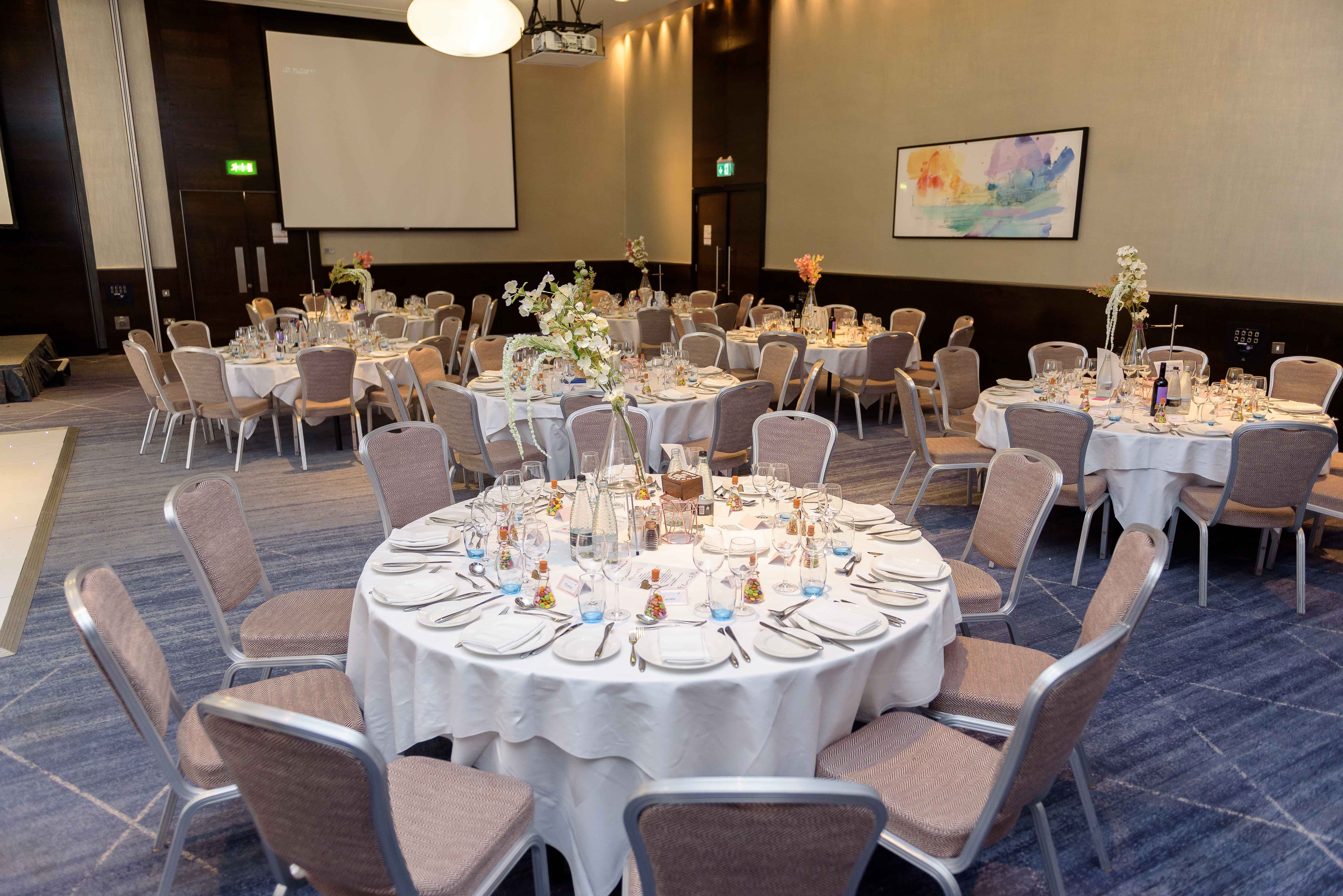 Elegant event space at Tower AB, Hilton London Tower Bridge, set for formal gatherings.