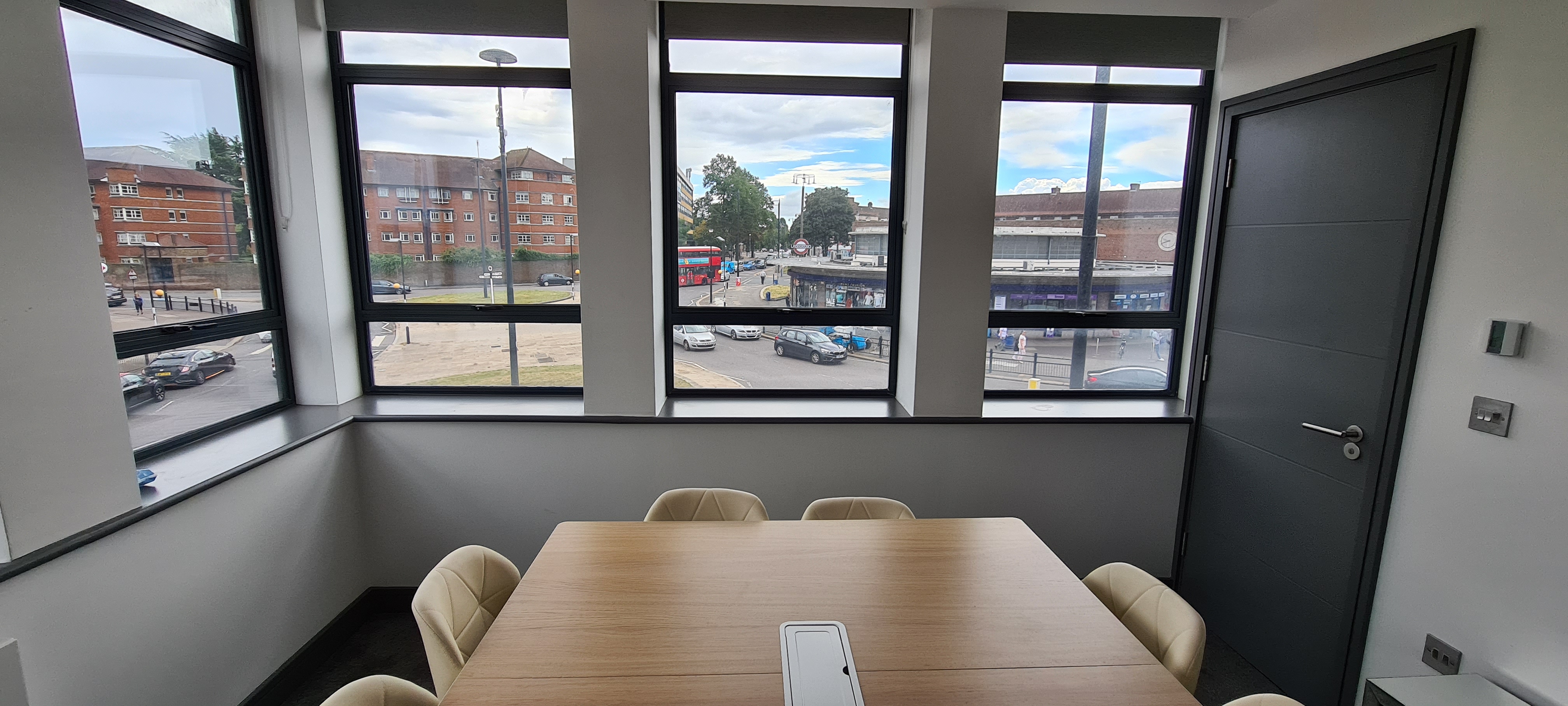 Modern Southpoint House meeting room with large windows for natural light and collaboration.