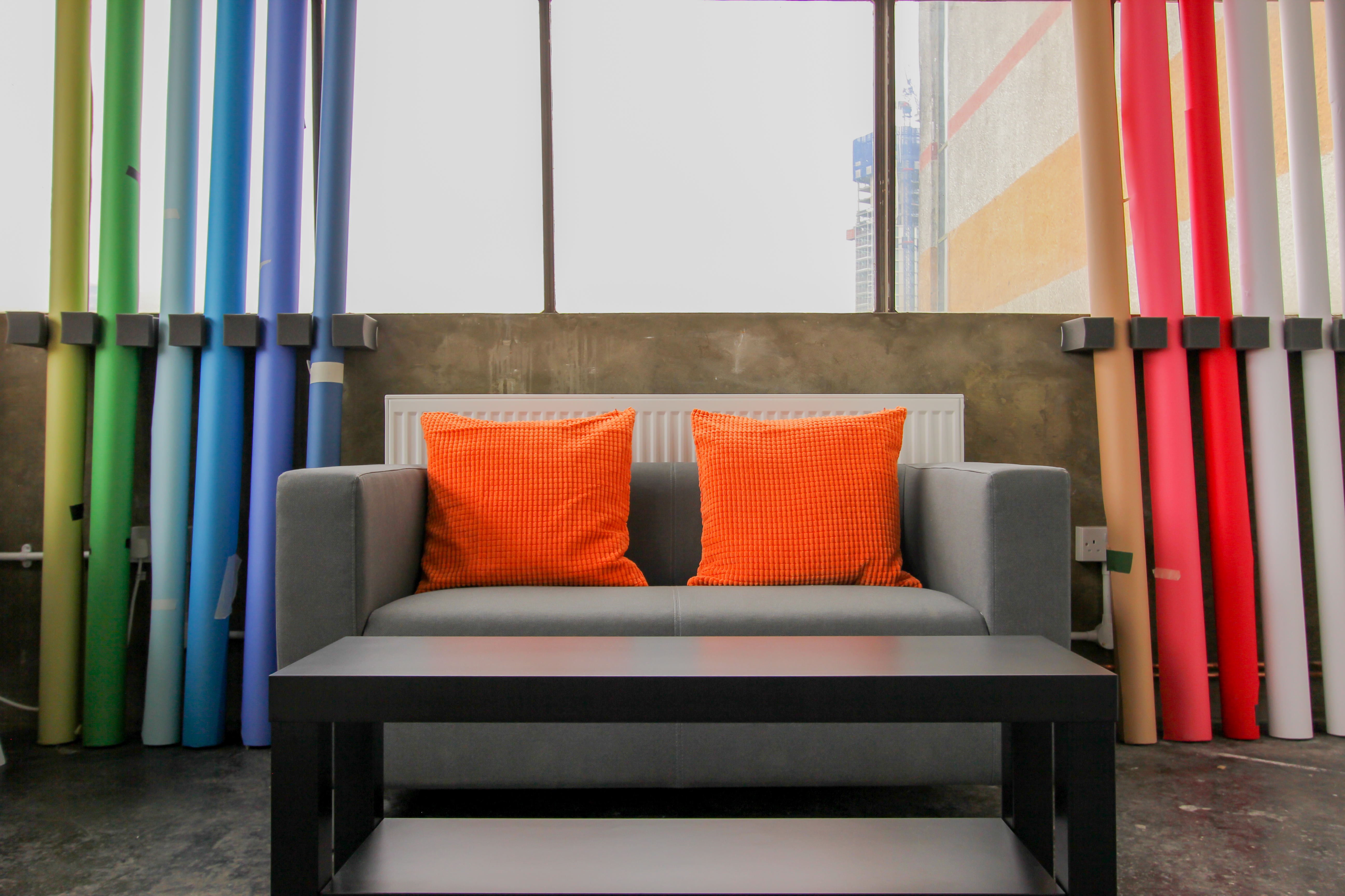 Modern lounge area in Aseptic Studios with colorful decor for networking events.