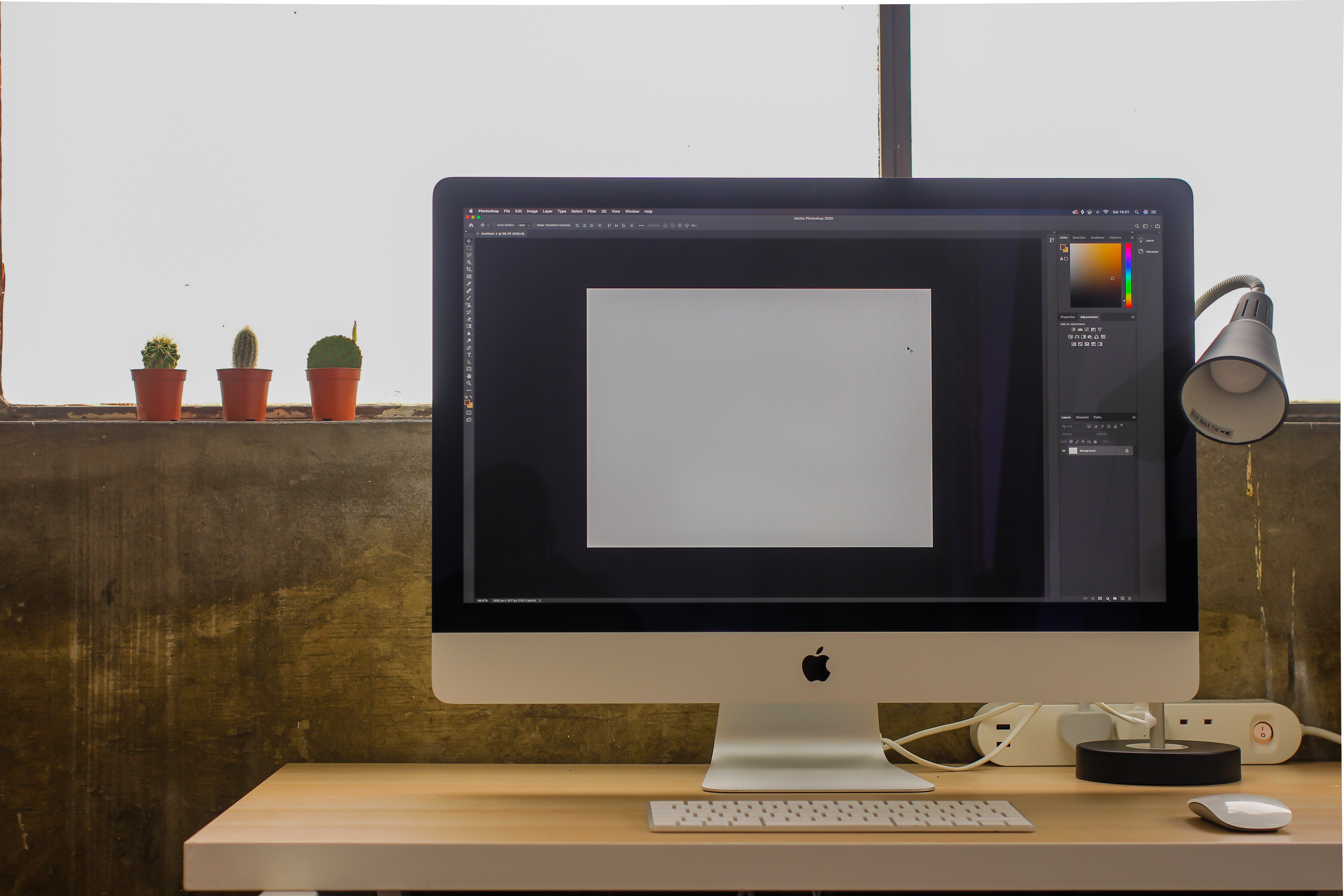 Modern workspace in Aseptic Studios with large monitor for event planning and design.