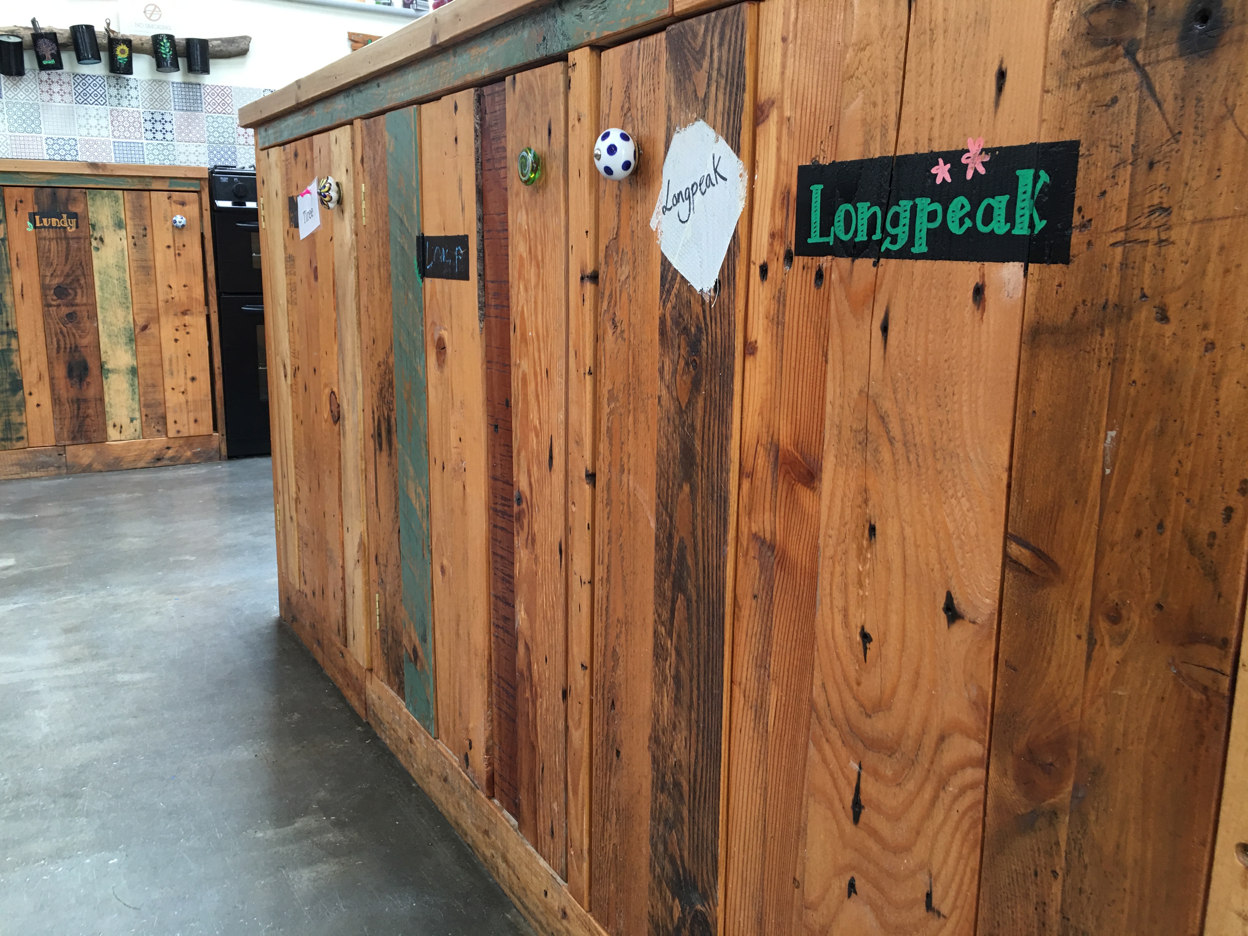 Rustic koa wood counter in a casual meeting space for creative brainstorming sessions.