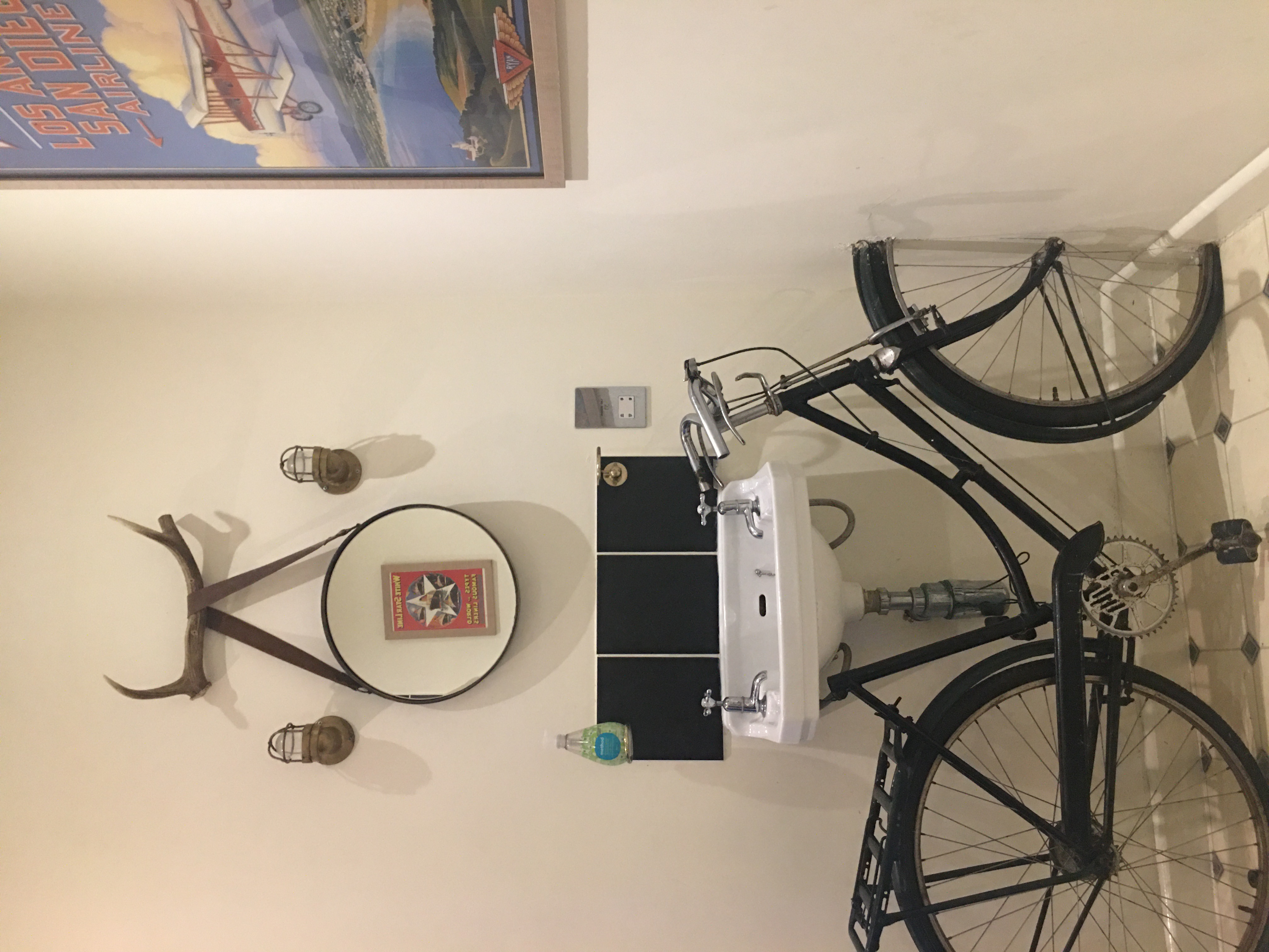 Vintage bicycle restroom setup in Koa Tree, enhancing event ambiance and guest experience.