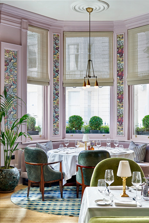 Elegant dining space in The Kensington's White Room for corporate dinners and upscale events.