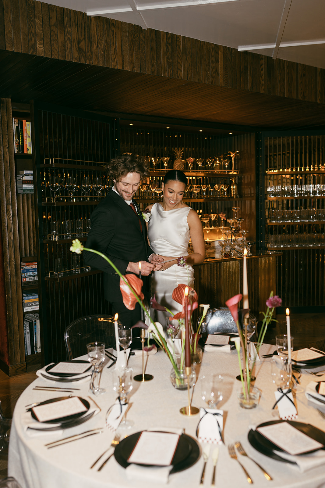 Couple celebrating in elegant bar at The Marylebone for wedding or anniversary event.