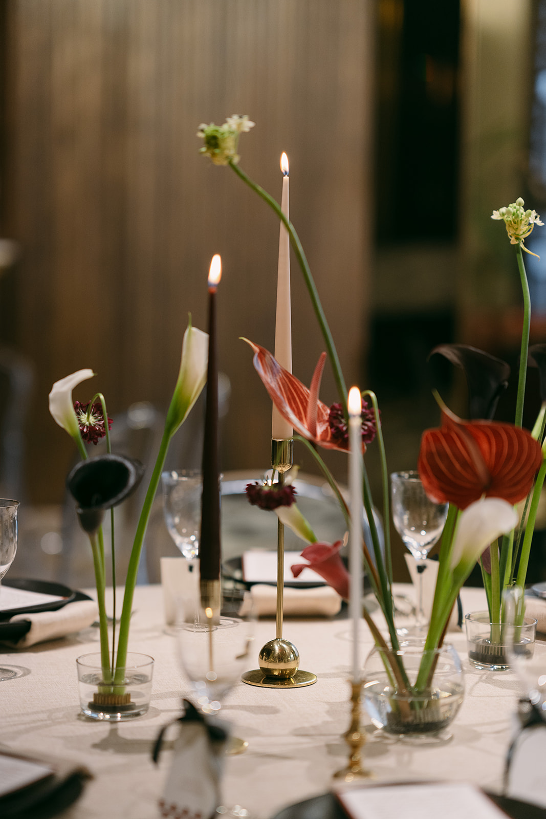 Elegant floral centerpiece with candles at Number Six, The Marylebone for upscale events.
