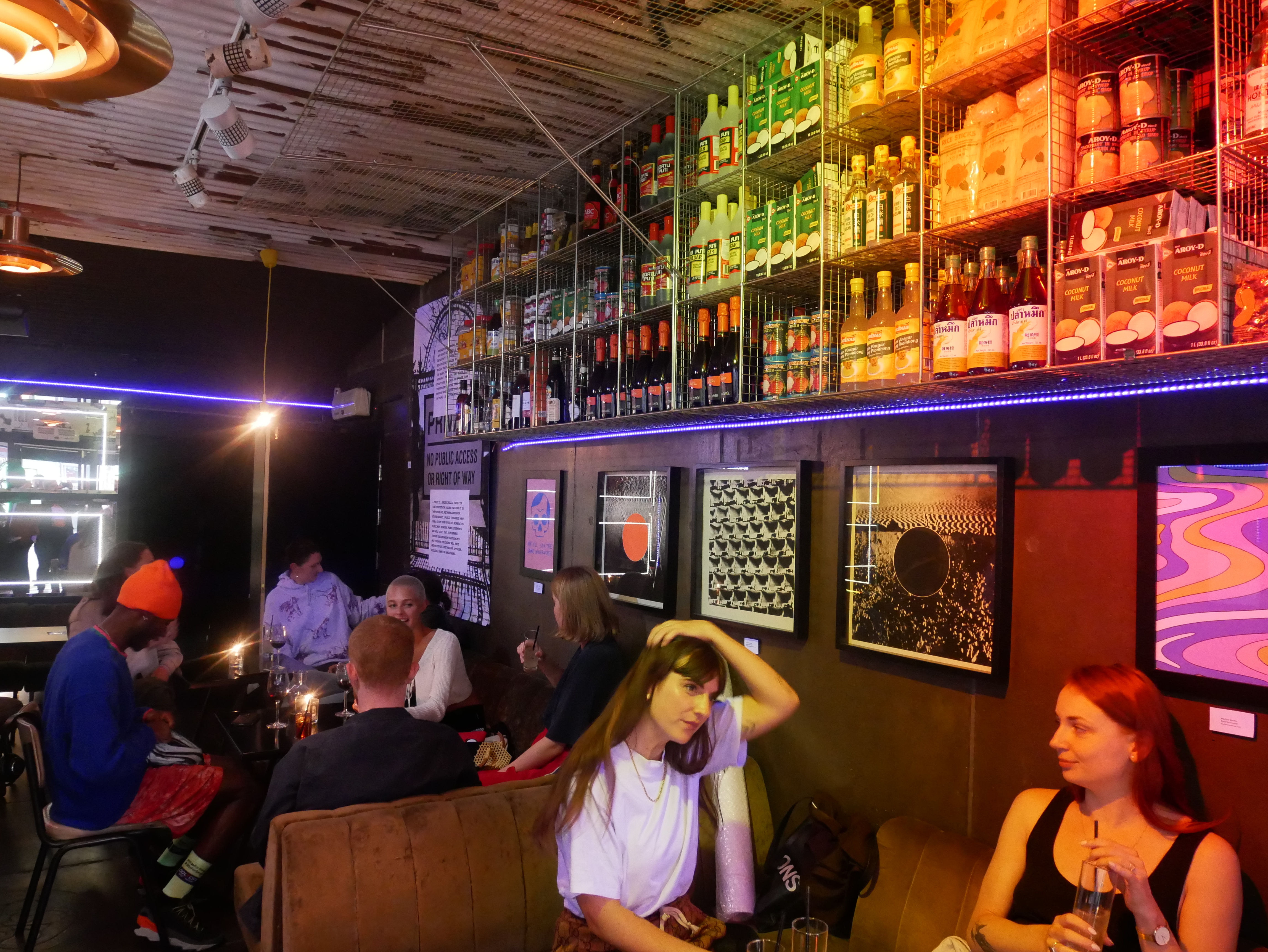 Vibrant Sugarlandia venue with colorful lighting for networking events and casual gatherings.