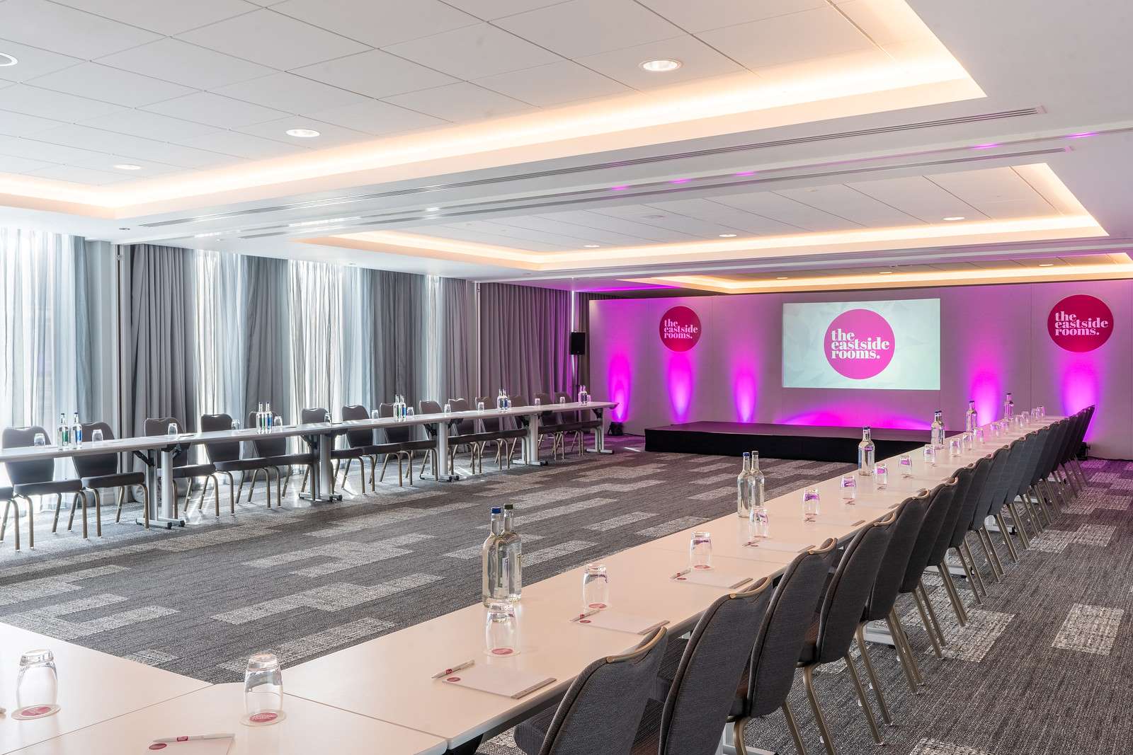 Belmont Suite meeting room with U-shaped table, ideal for professional events and presentations.