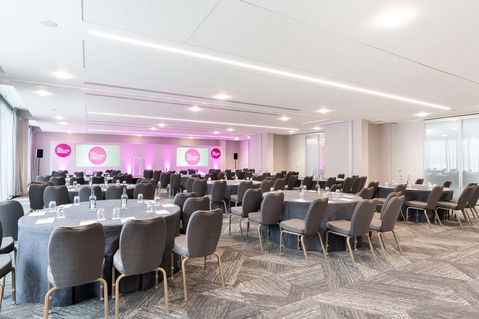 Belmont Suite event space with round tables, ideal for conferences and banquets.