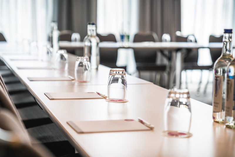 Meeting Room Eleven with long table setup for professional meetings and events.