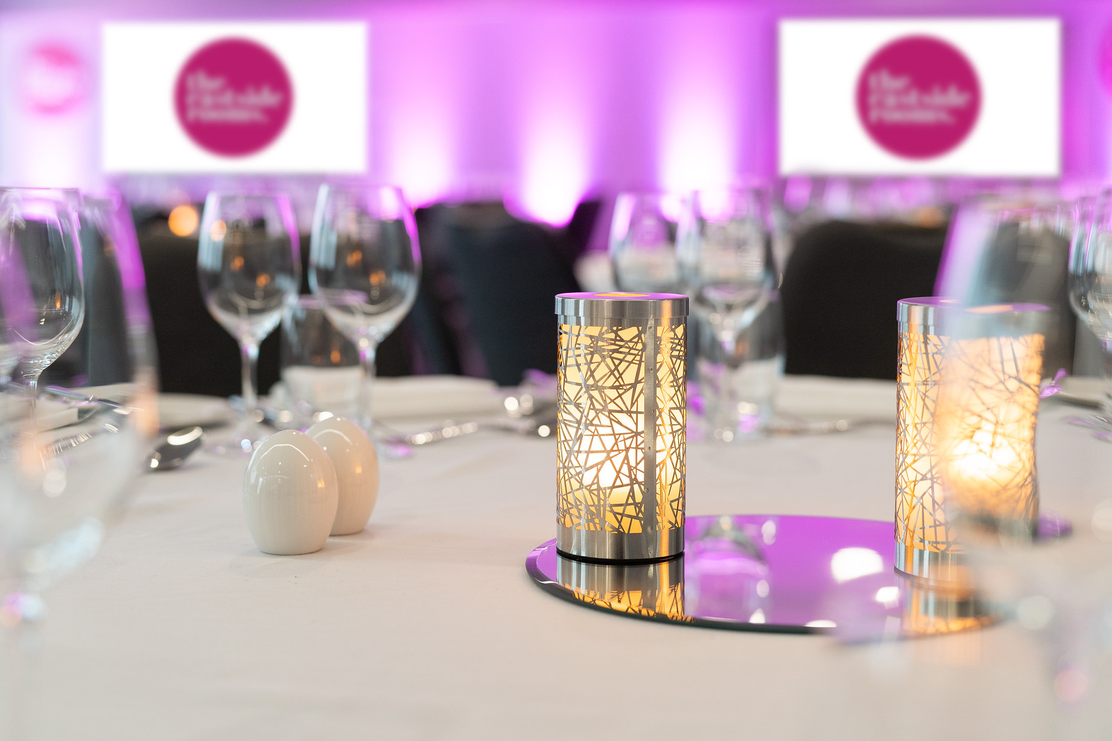 Elegant dining table with candle holders in Ashtead Suite, perfect for sophisticated events.