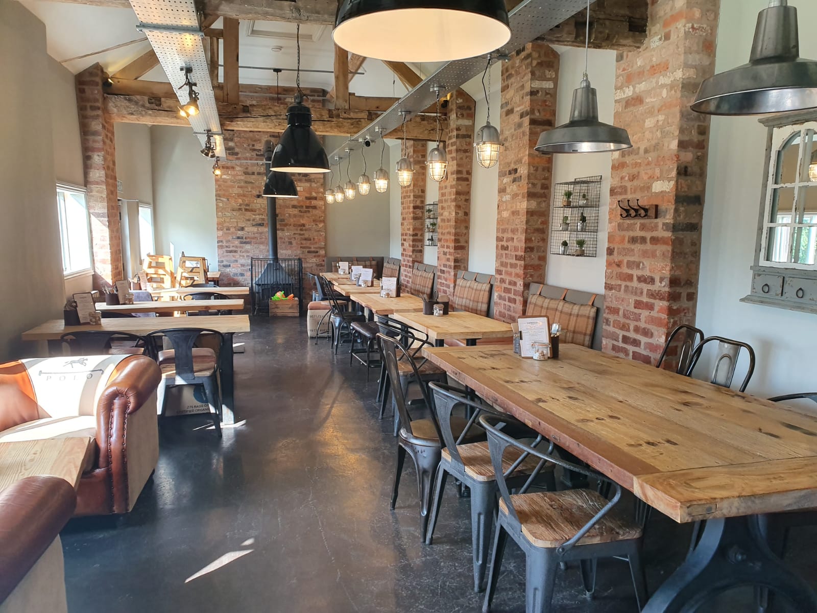 Spacious rustic venue with exposed brick for meetings and events at Espresso Farm.