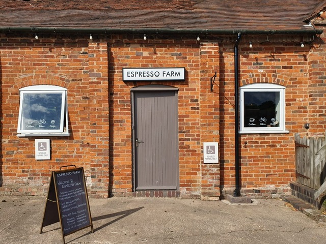 Charming Espresso Farm venue with rustic brick exterior, perfect for casual meetings and events.