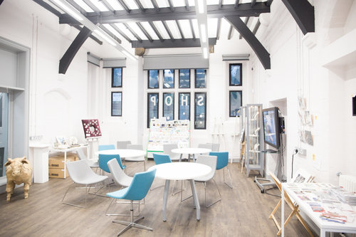 Modern event space at Chesterfield College with natural light, ideal for workshops and meetings.