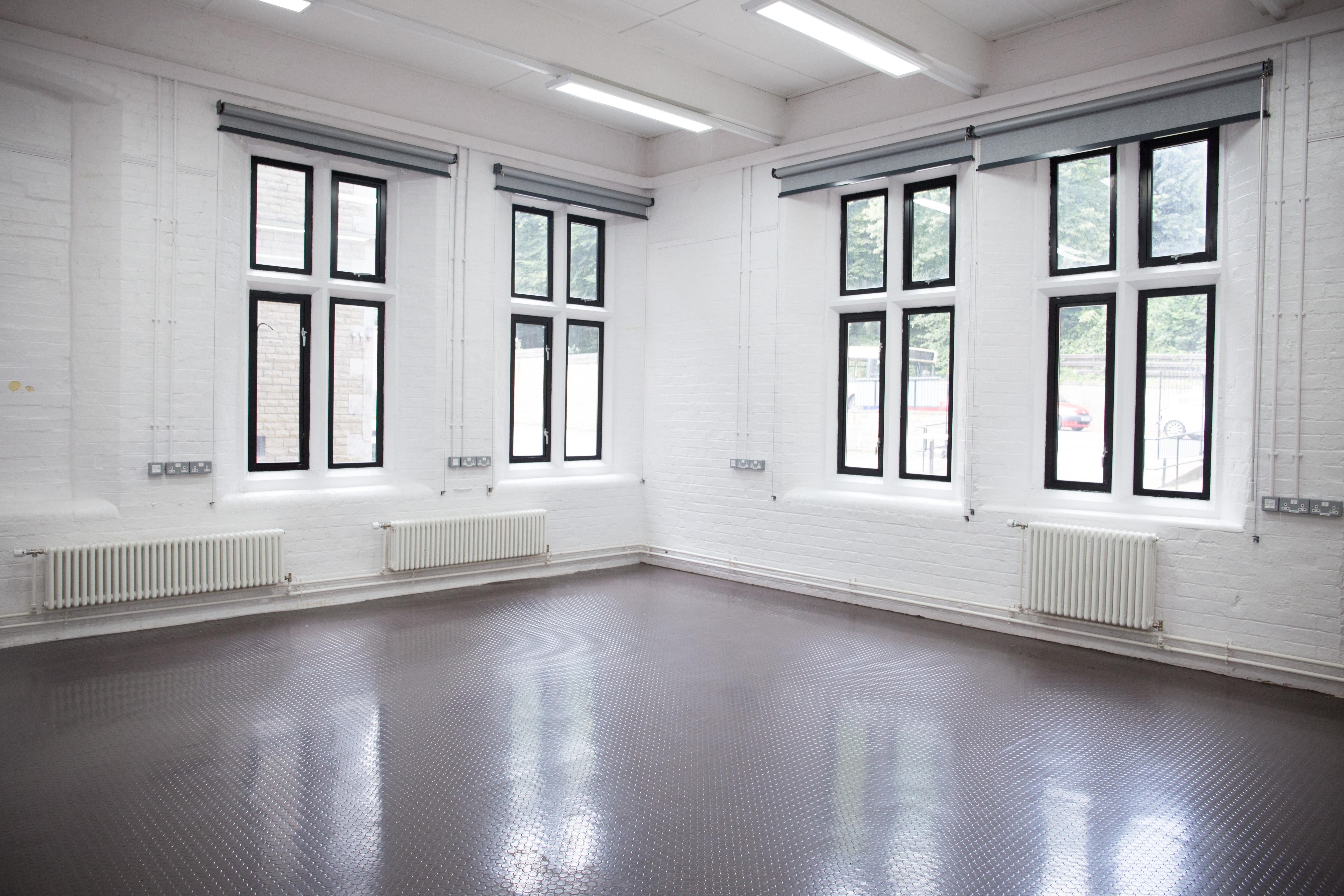 Versatile meeting space at Chesterfield College with large windows for events and workshops.