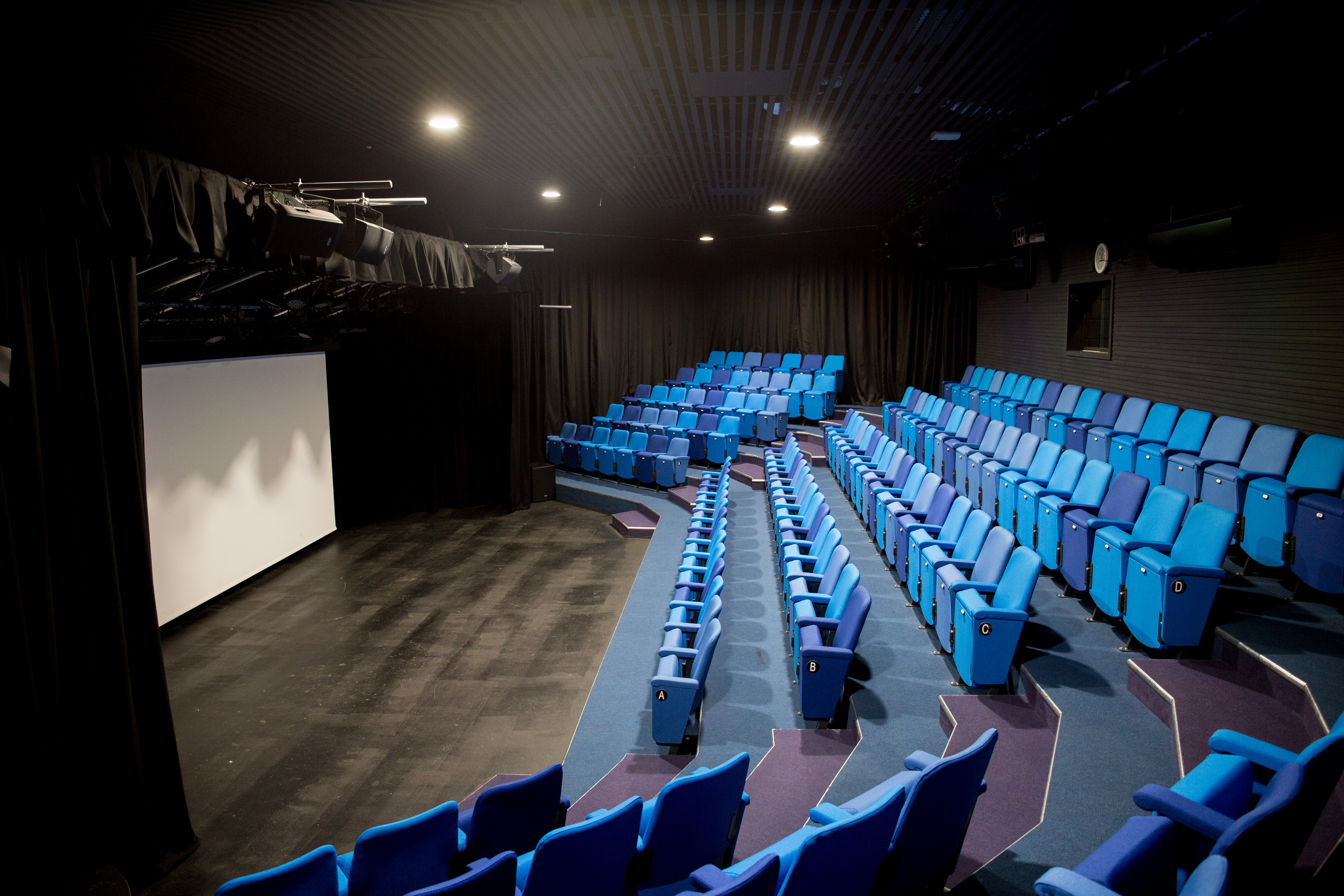 Modern theater space at Chesterfield College with tiered seating for events and presentations.
