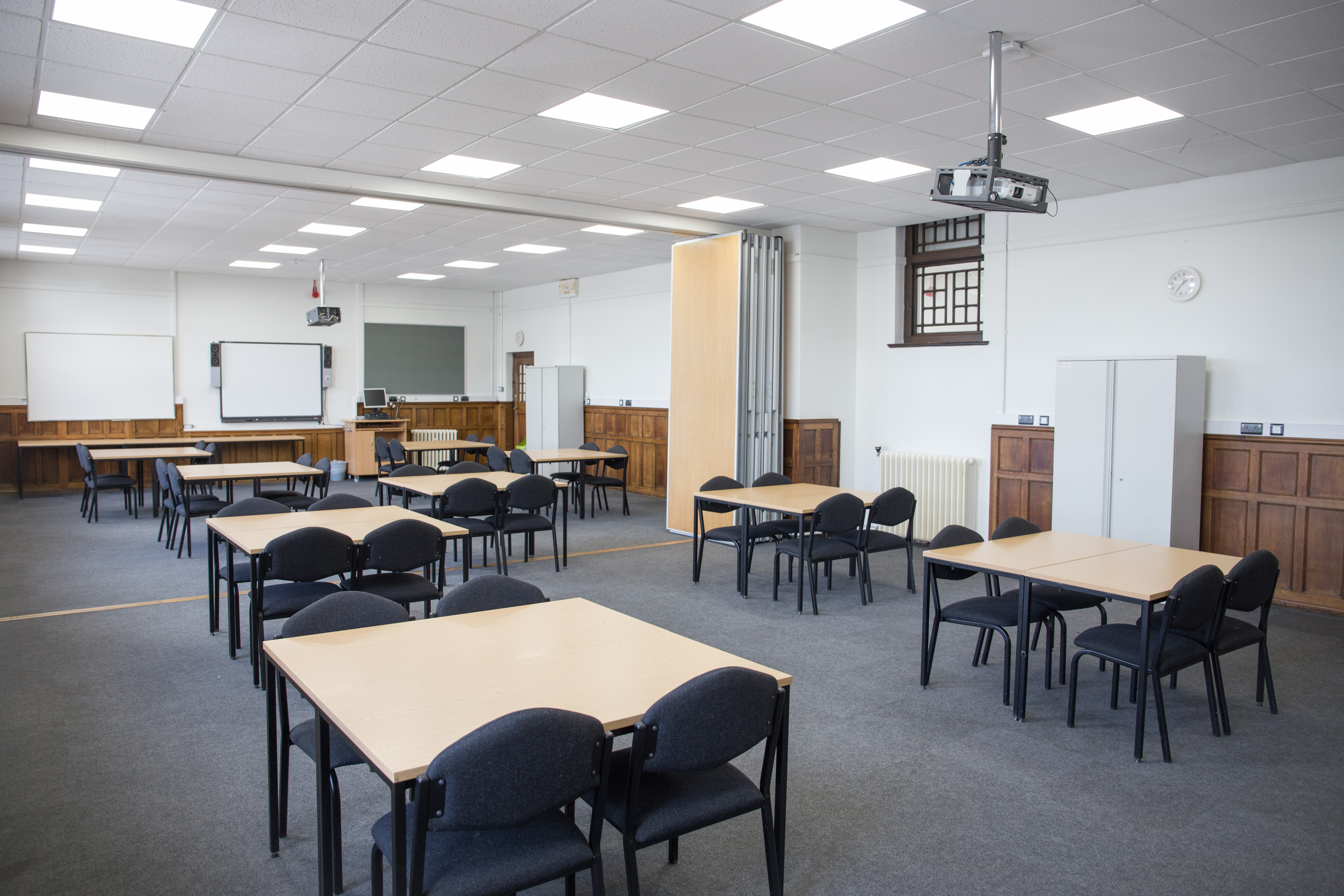 Versatile Chesterfield College classroom with natural light, ideal for workshops and training.