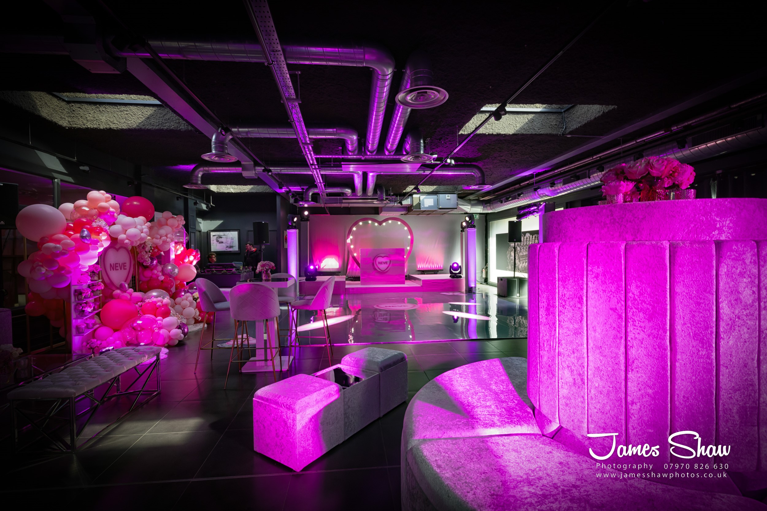 V12 Room event space with pink decor, ideal for parties and corporate gatherings.