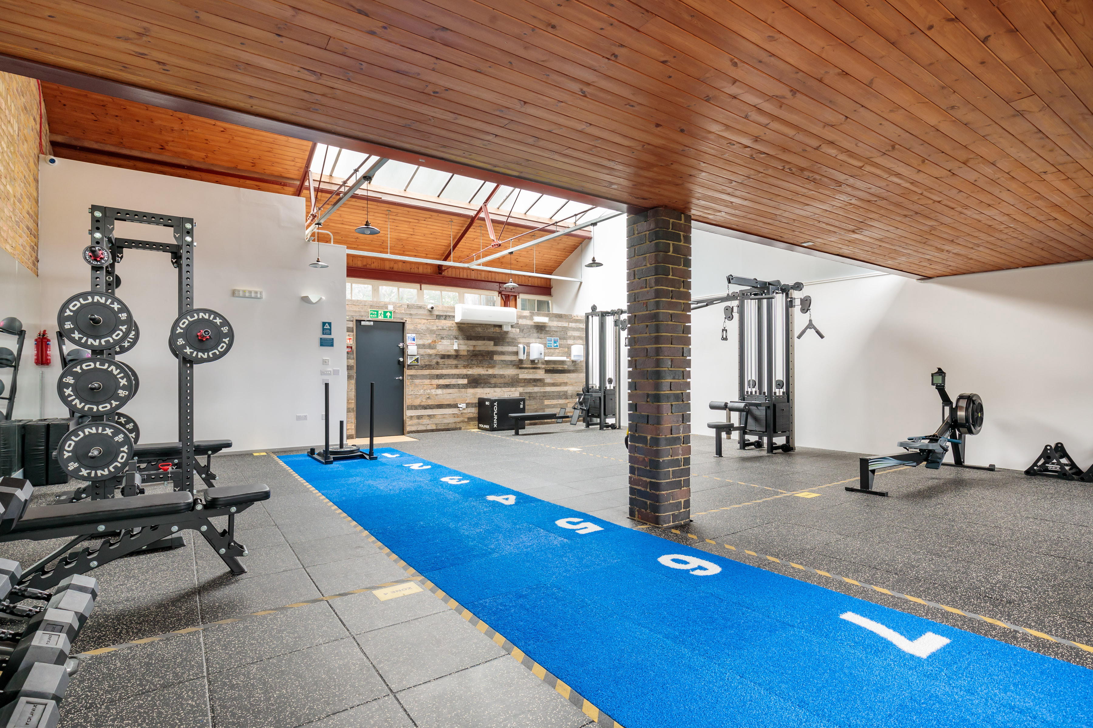 Modern fitness venue with workout stations for wellness events and team-building activities.