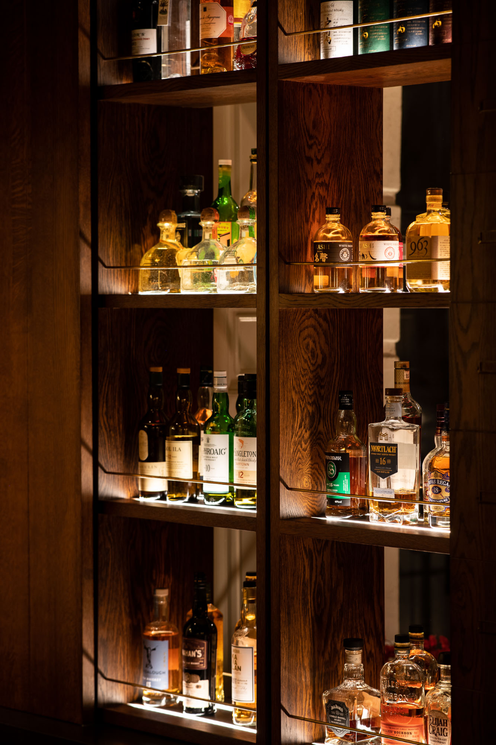 Malt Lounge bar display with premium spirits, perfect for networking events and cocktail receptions.