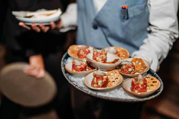 Gourmet appetizers on an elegant tray at The Malt Lounge & Bar, ideal for upscale events.