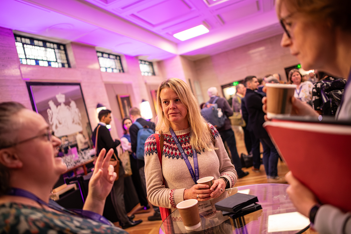 Networking event at MacMillan Hall, University of London, with engaged attendees.