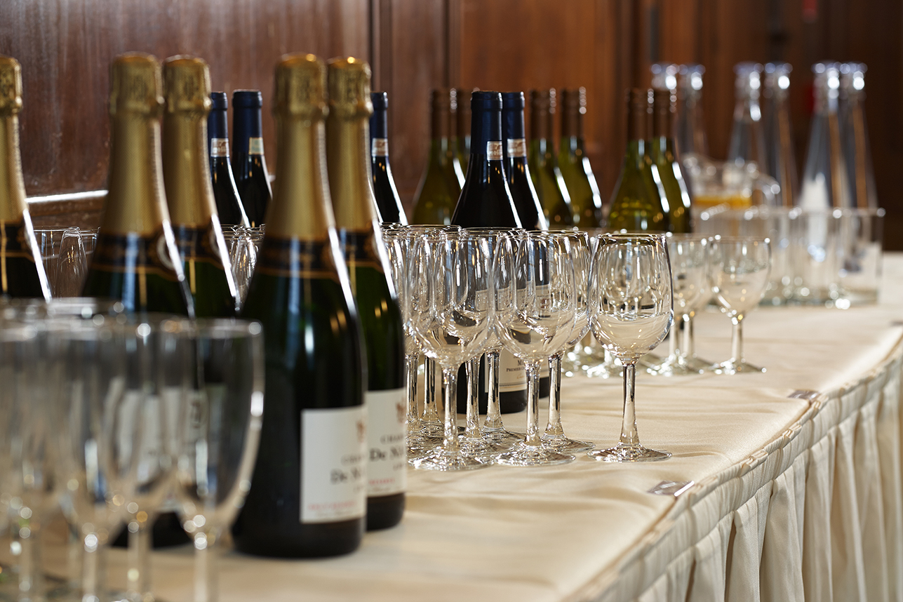 Elegant beverage station with wines at Woburn Suite, University of London event venue.