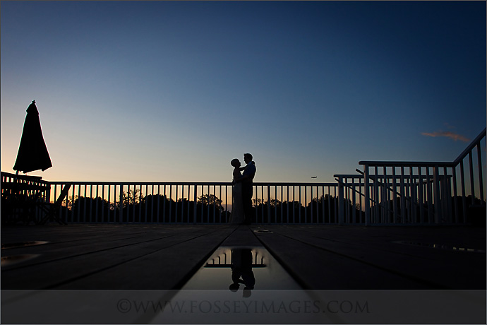 Rooftop terrace sunset silhouette of a couple, perfect for romantic weddings and events.