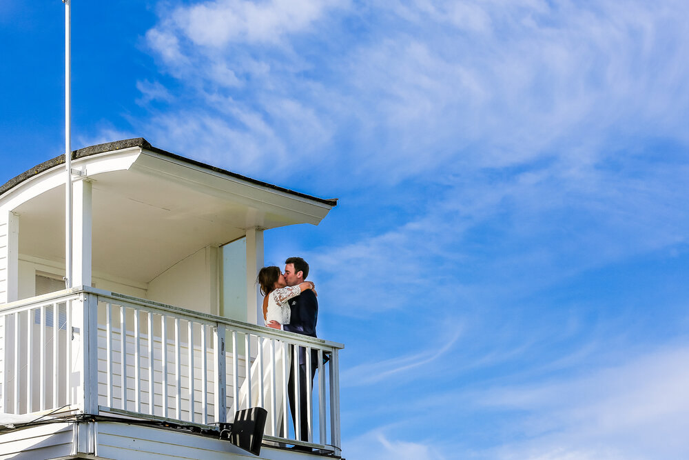 Couple embracing on Ham Polo Club rooftop terrace, perfect for weddings and engagements.
