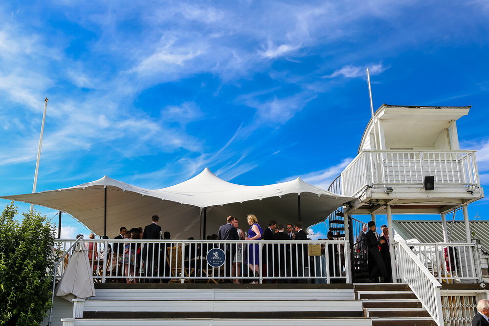 Rooftop terrace at Ham Polo Club with elegant tent for outdoor receptions and events.
