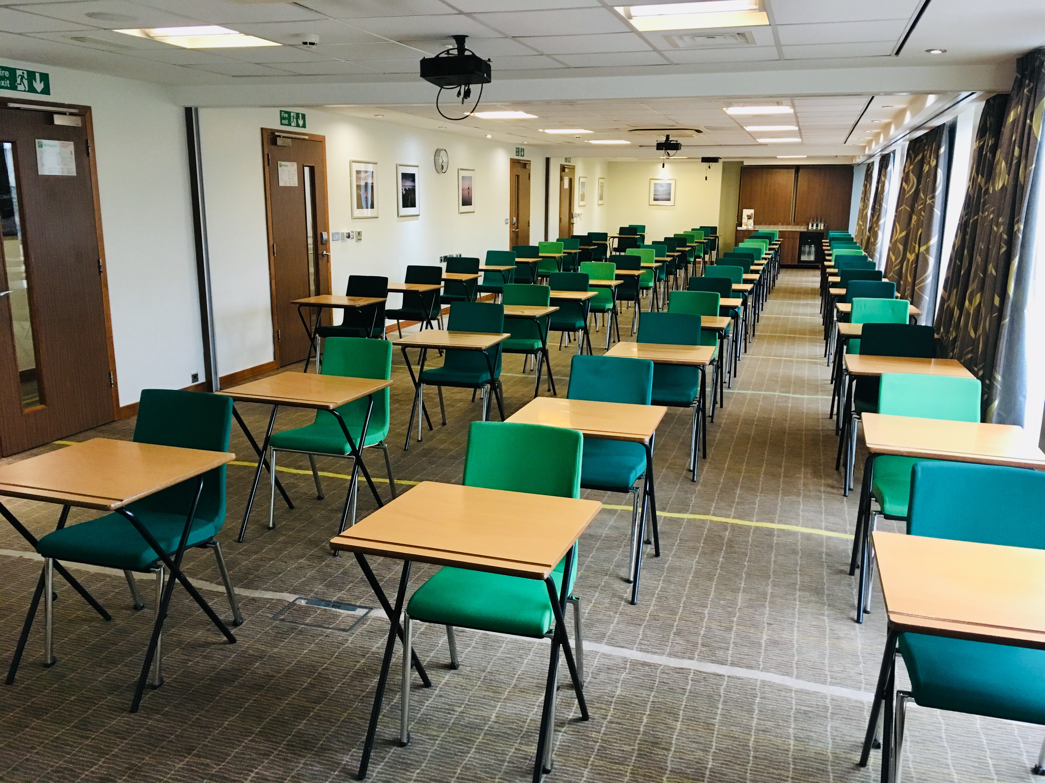 Academy Meeting Rooms at Holiday Inn Bristol, seminar setup with green chairs and natural light.