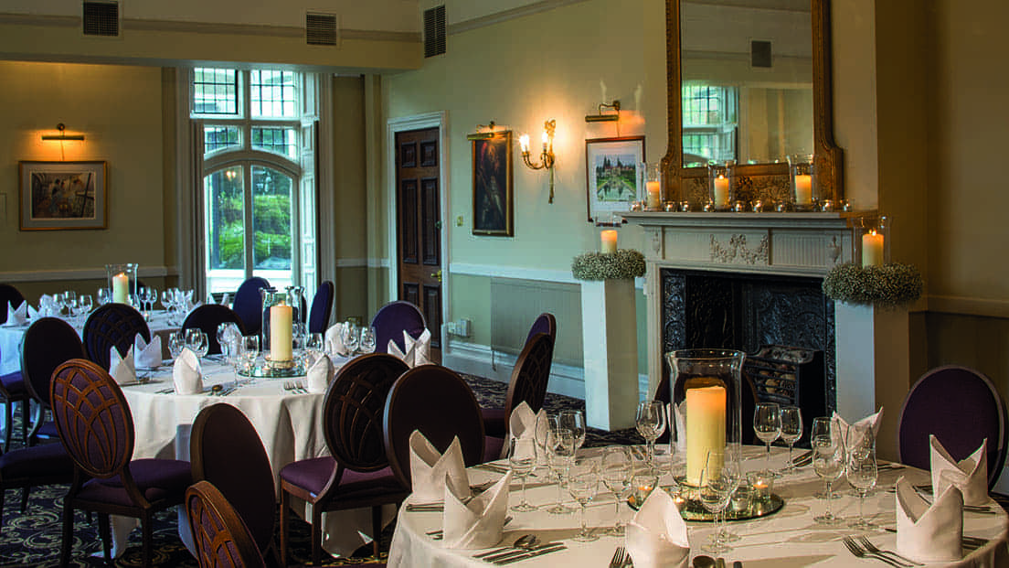 Elegant dining room at Rhinefield House Hotel, perfect for upscale events and formal dinners.