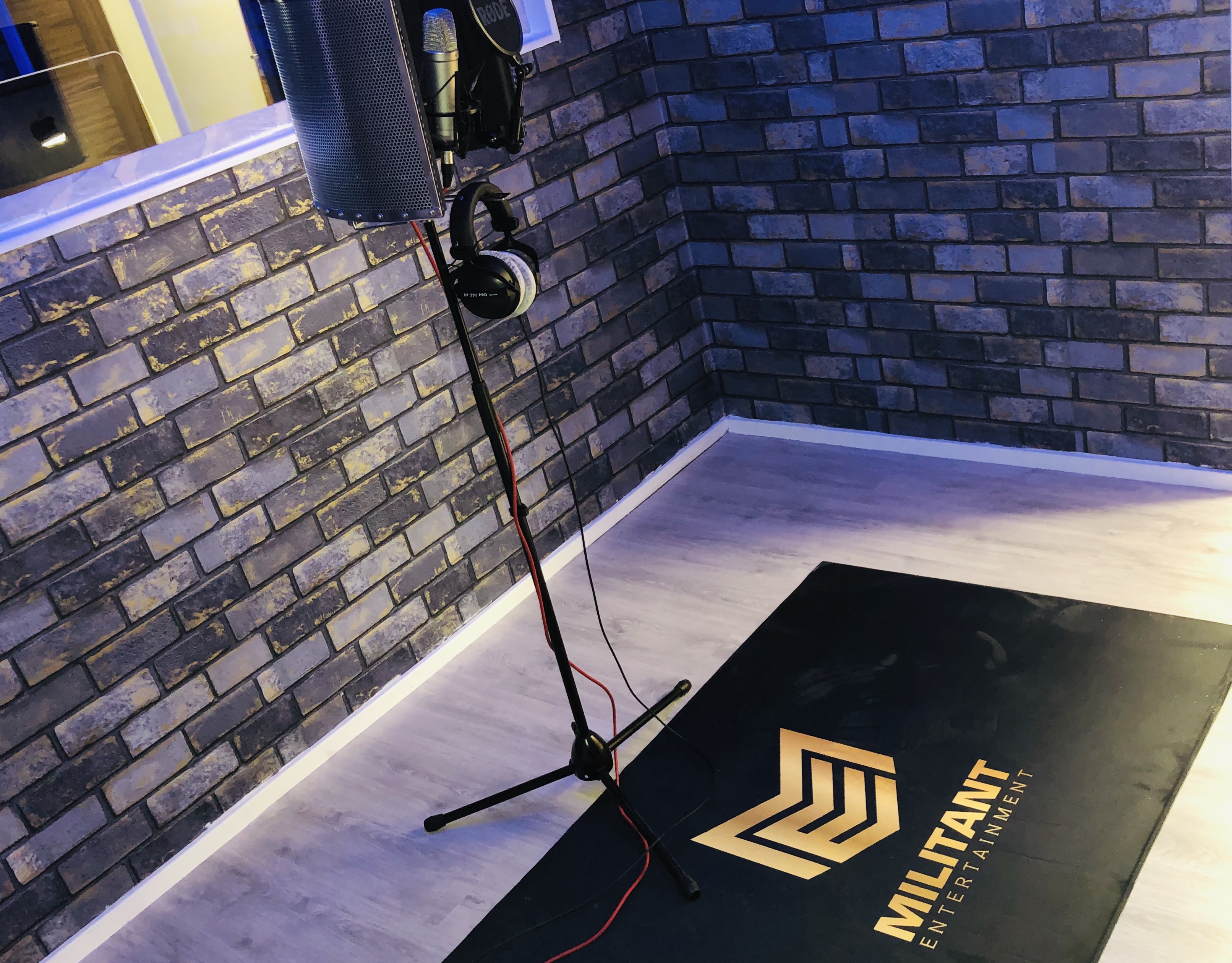 Recording studio with sleek sound setup, ideal for podcasts and workshops.