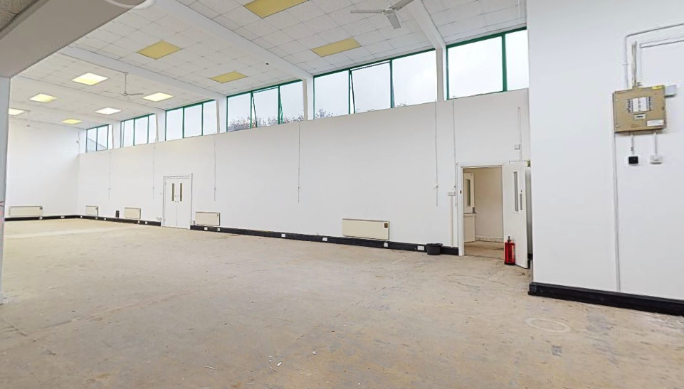 Spacious event venue in Moxon House with natural light, ideal for meetings and workshops.