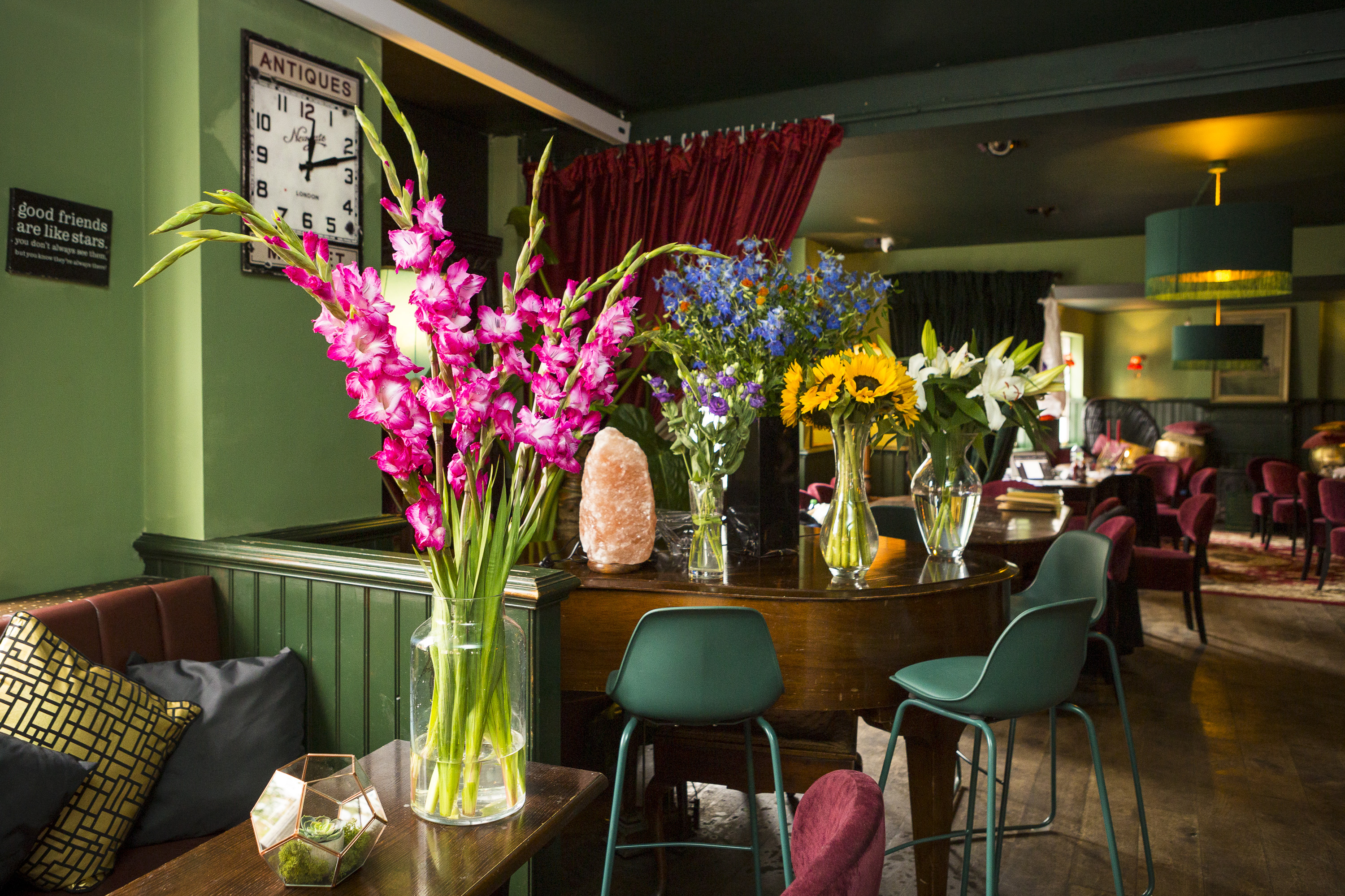 Vibrant event space with floral decor for networking and gatherings at Biddy Mulligan's.