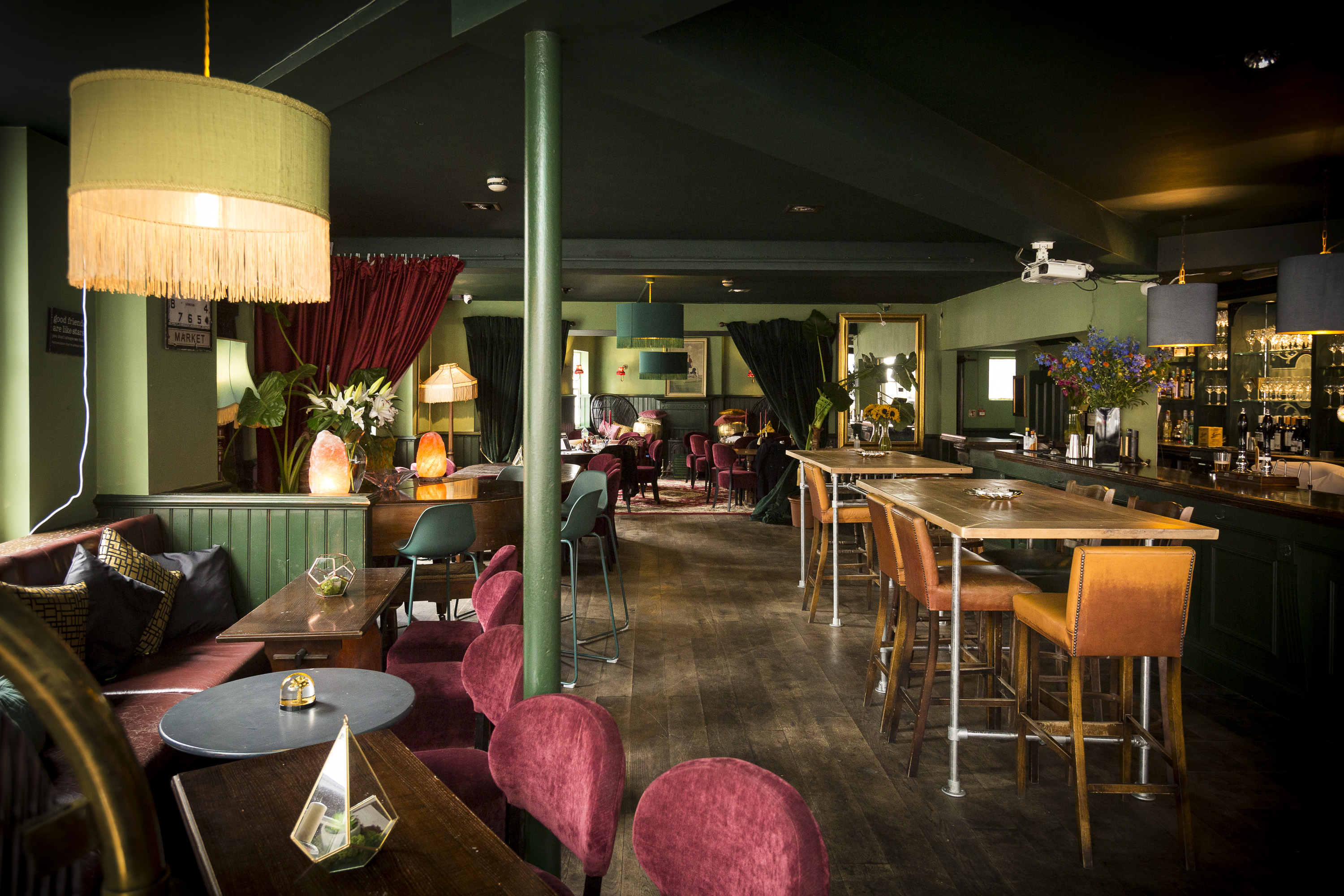 Stylish event venue with warm lighting, ideal for meetings and gatherings.