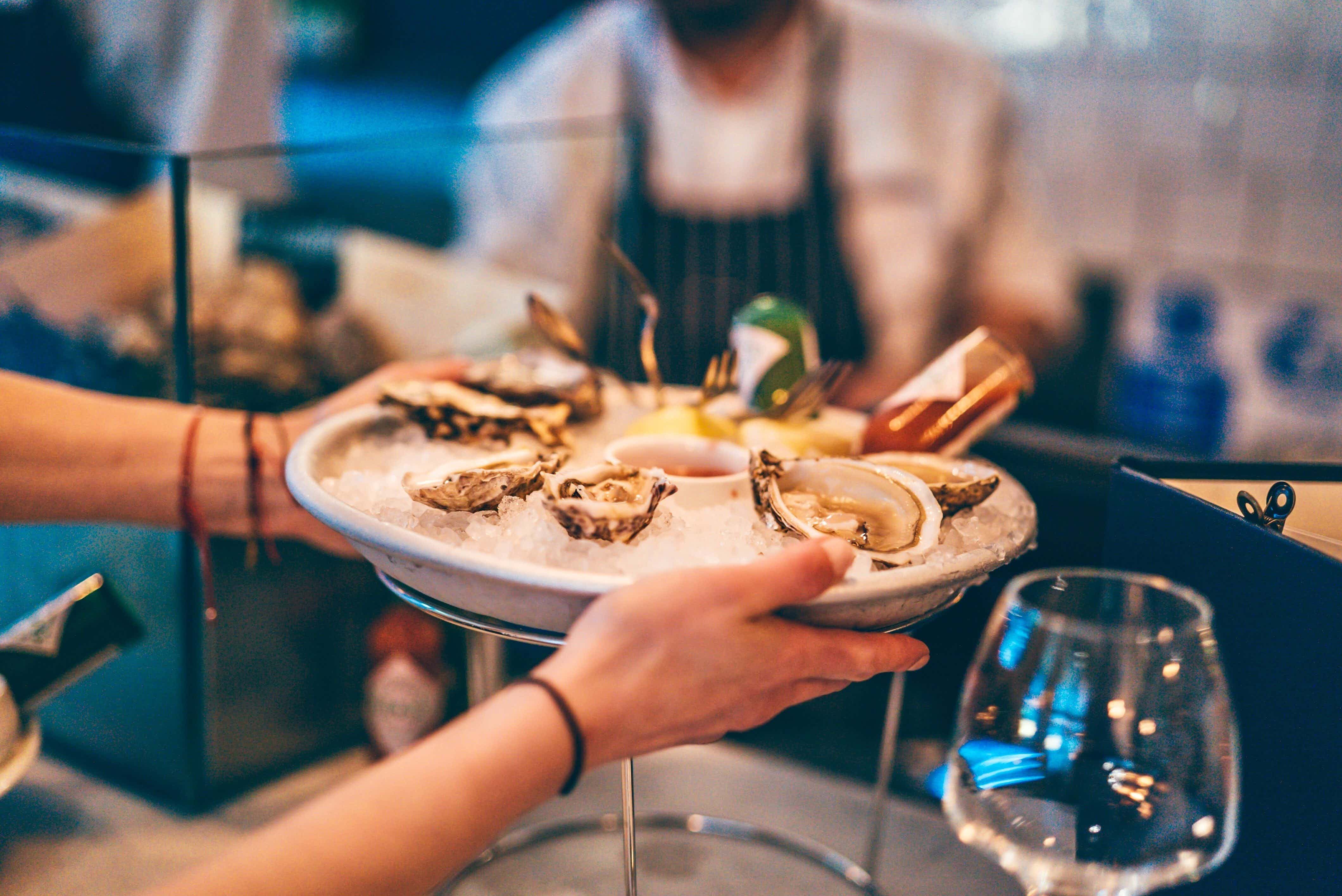 Elegant oyster platter on ice at The Cove, perfect for upscale receptions and seafood events.