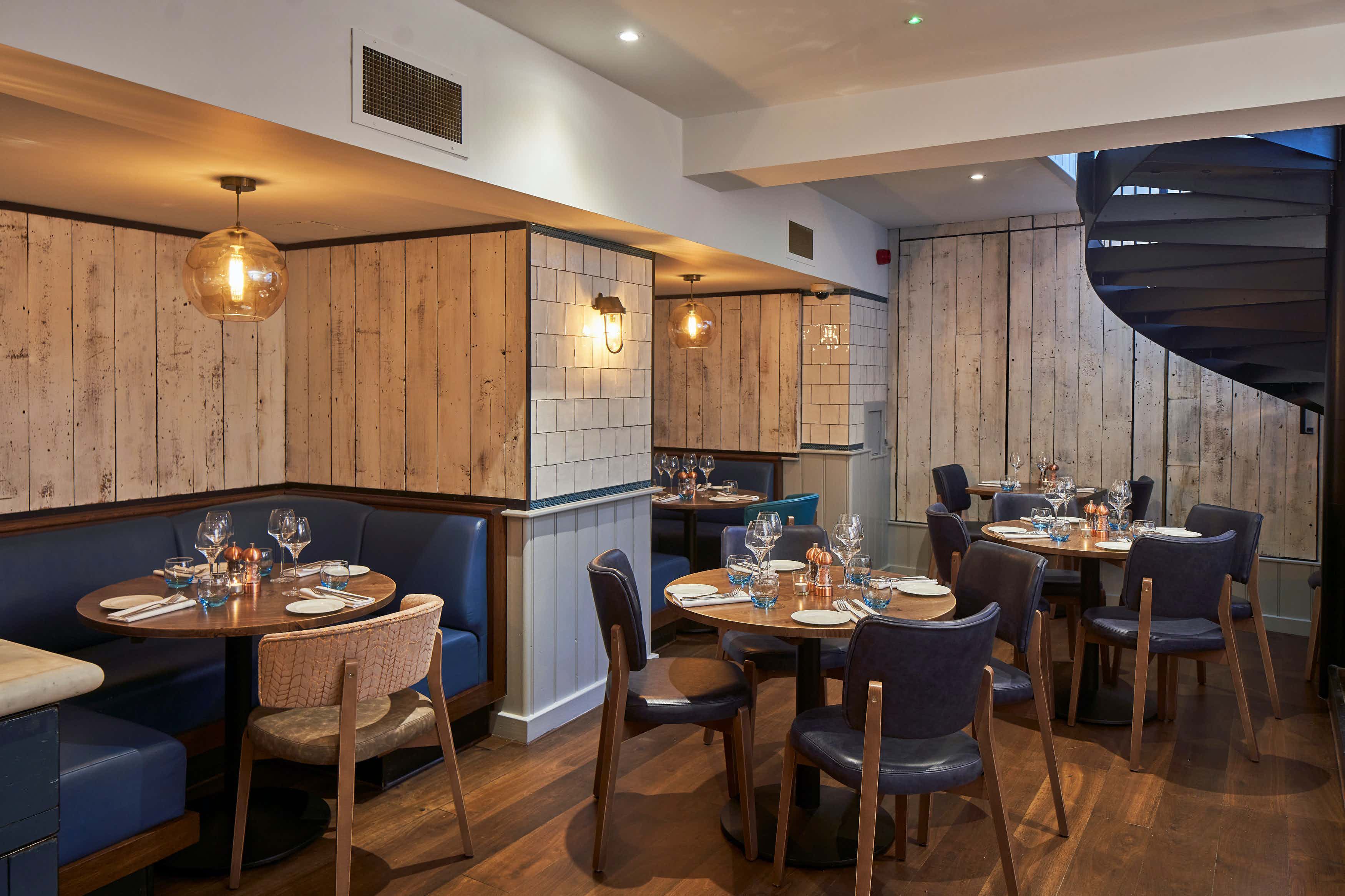 Stylish restaurant interior with warm wood accents for private dining events in Covent Garden.
