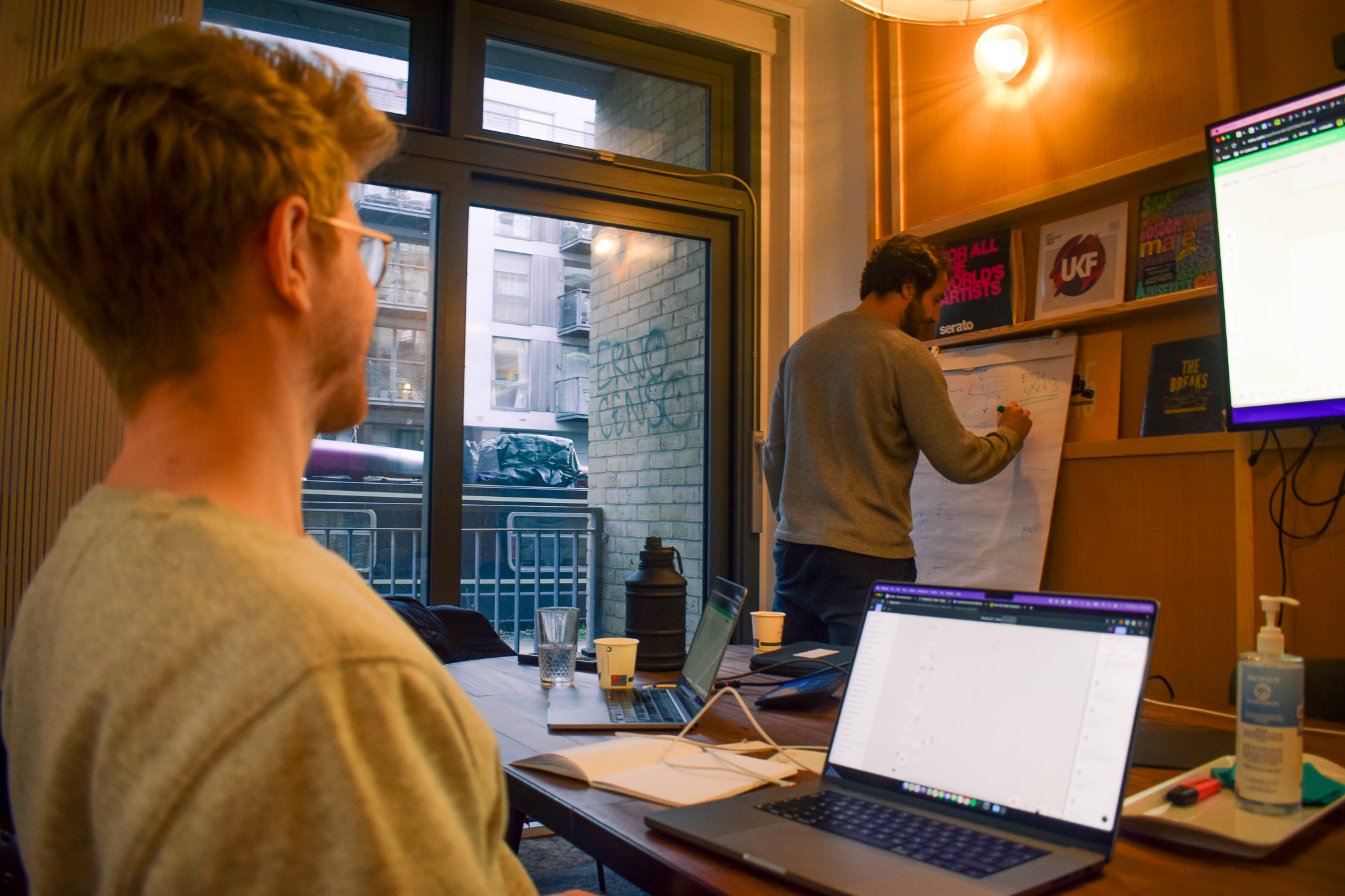 Nova Meeting Room at The Halley: collaborative space with laptop and flip chart for brainstorming.