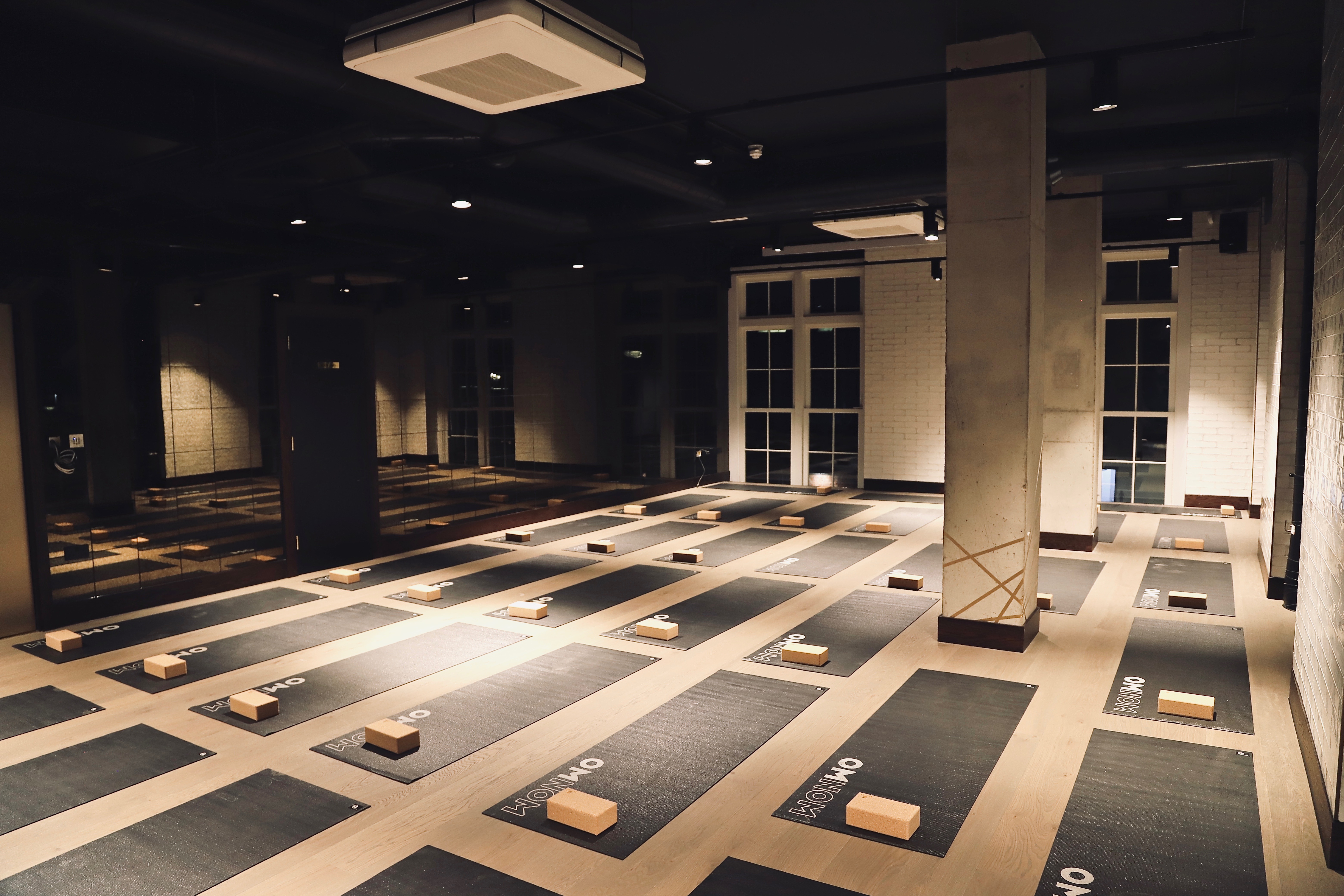 Spacious yoga studio with mats for wellness workshops and corporate retreats.