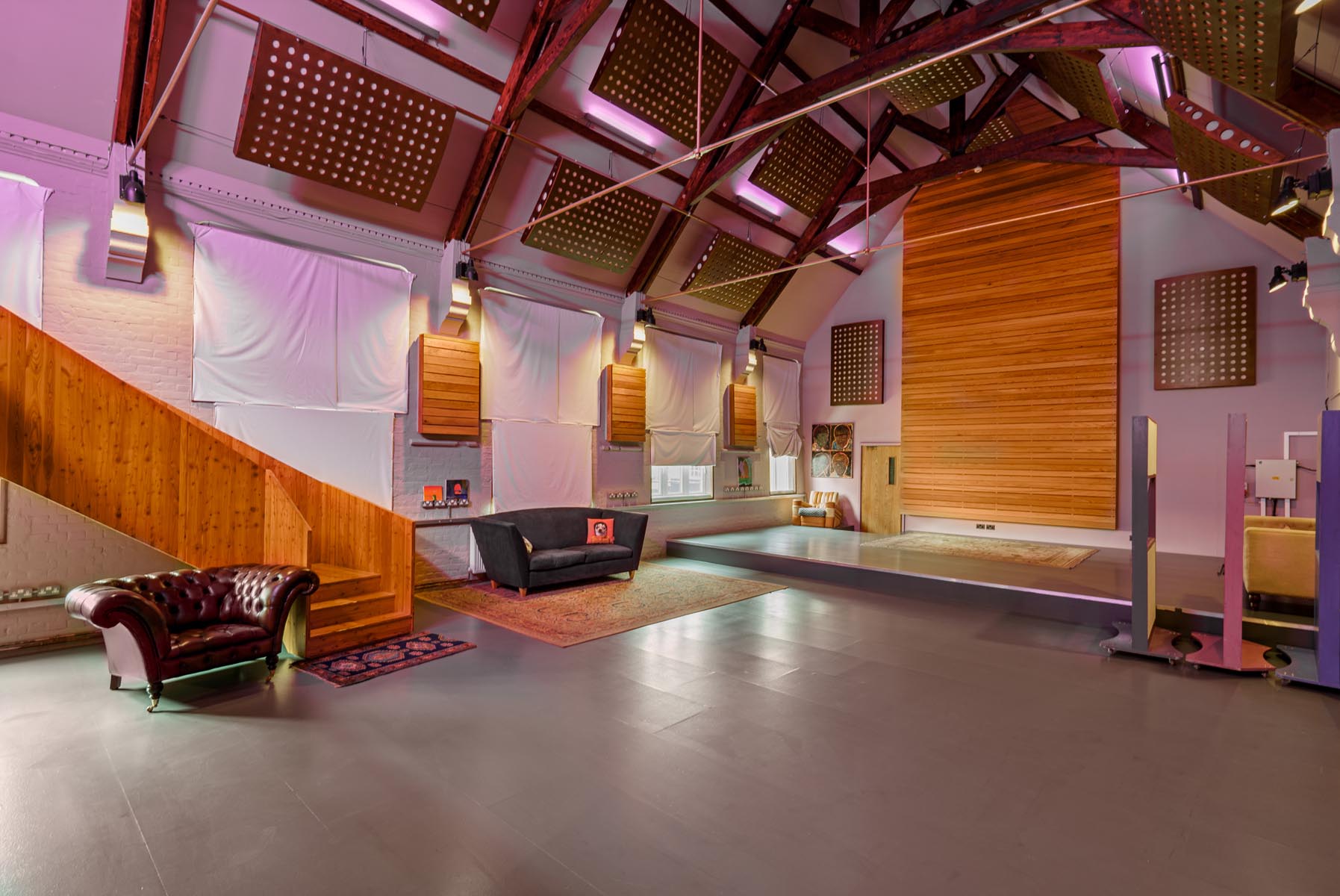 Versatile event space with high ceilings, ideal for corporate meetings and social gatherings.