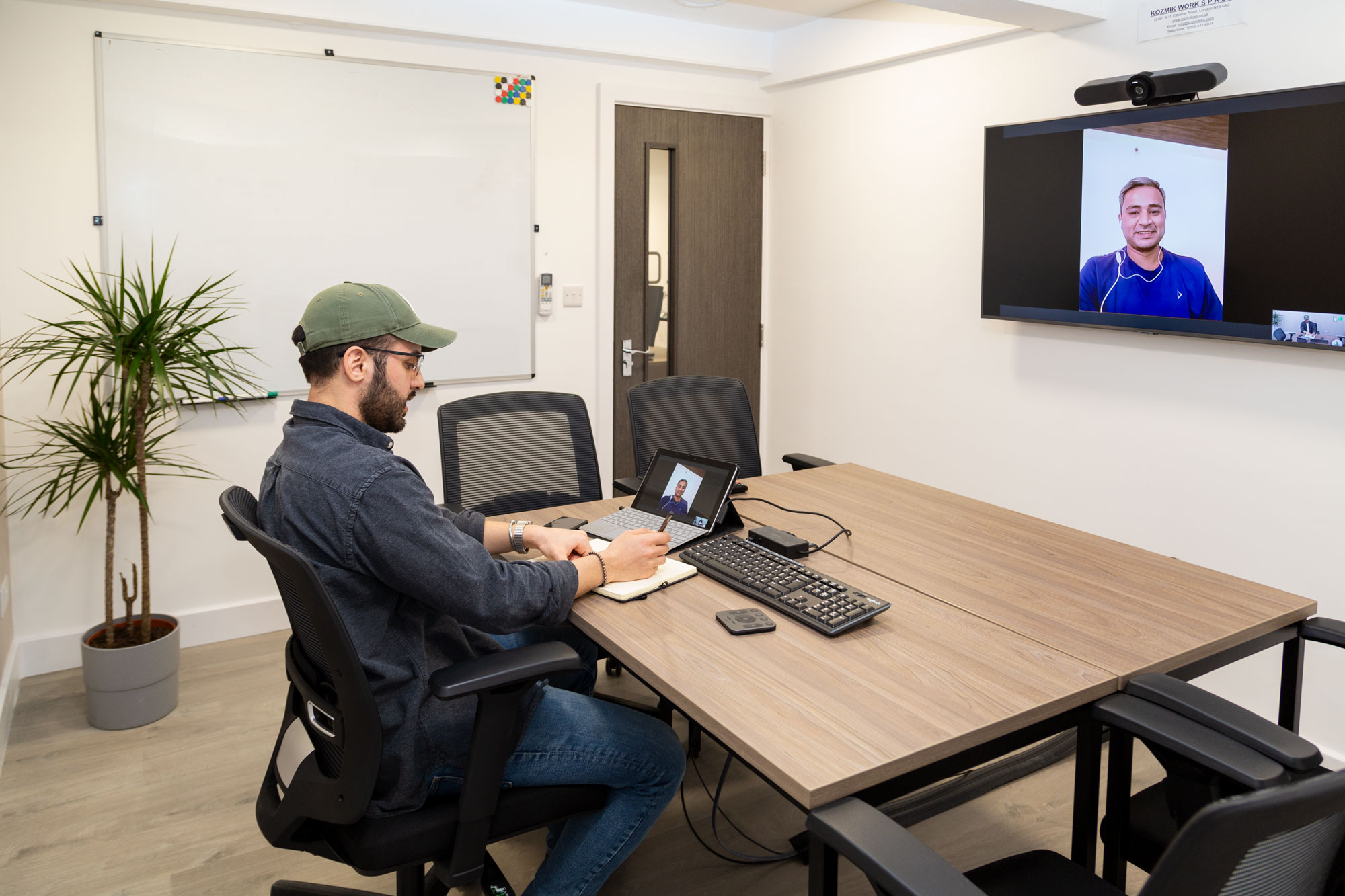 Hybrid meeting setup in modern conference room for seamless virtual collaboration.