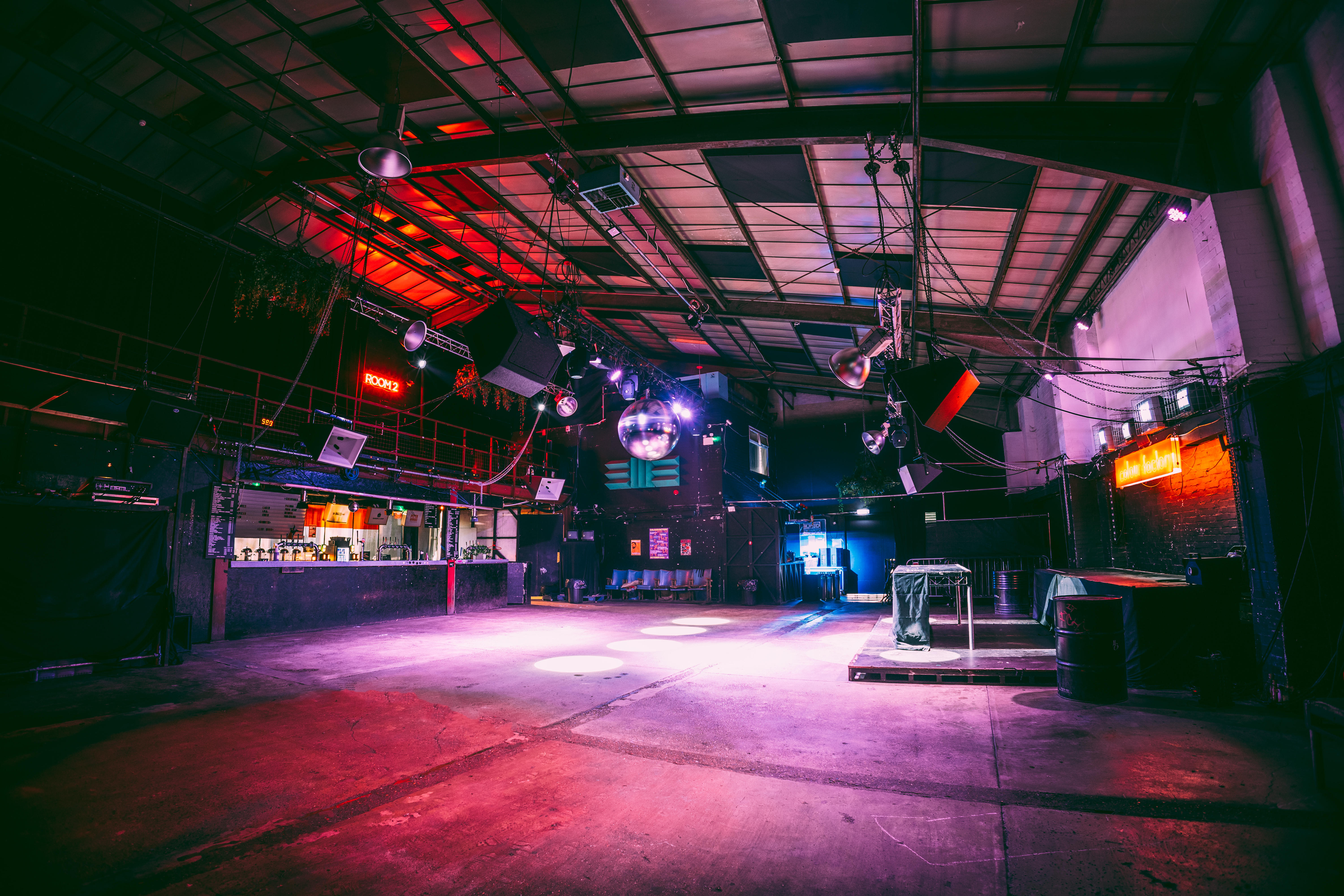 Versatile event space with high ceilings at Colour Factory for corporate and social gatherings.