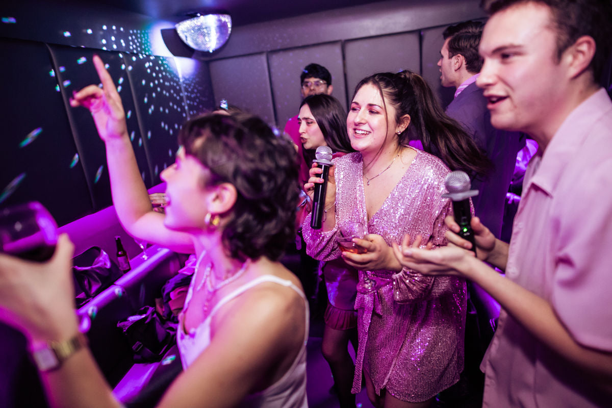 Private karaoke pods at Lucky Voice Islington, vibrant group enjoying team bonding event.