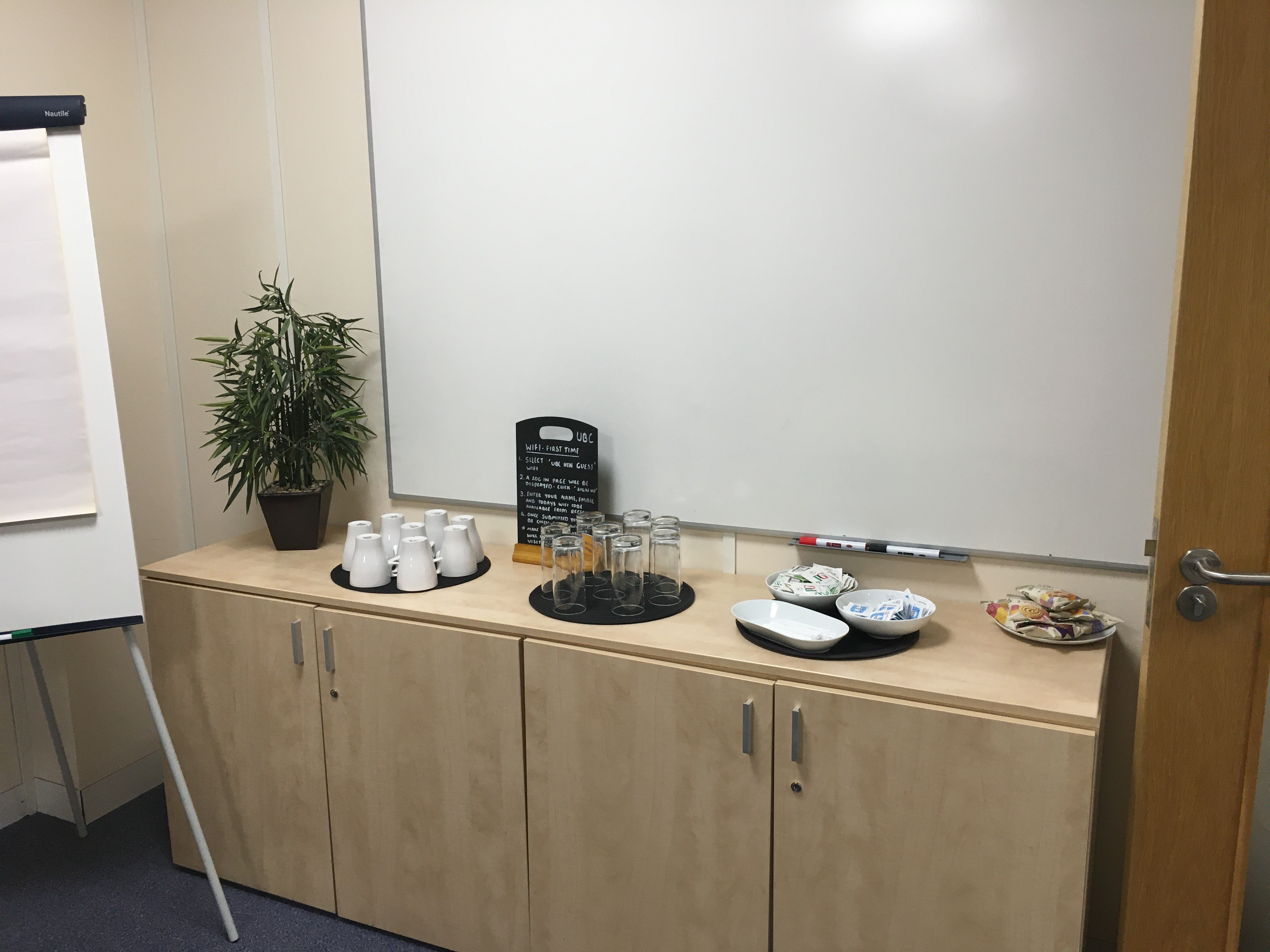 Refreshment station at UBC Henley in Arden for meetings, featuring snacks and beverages.