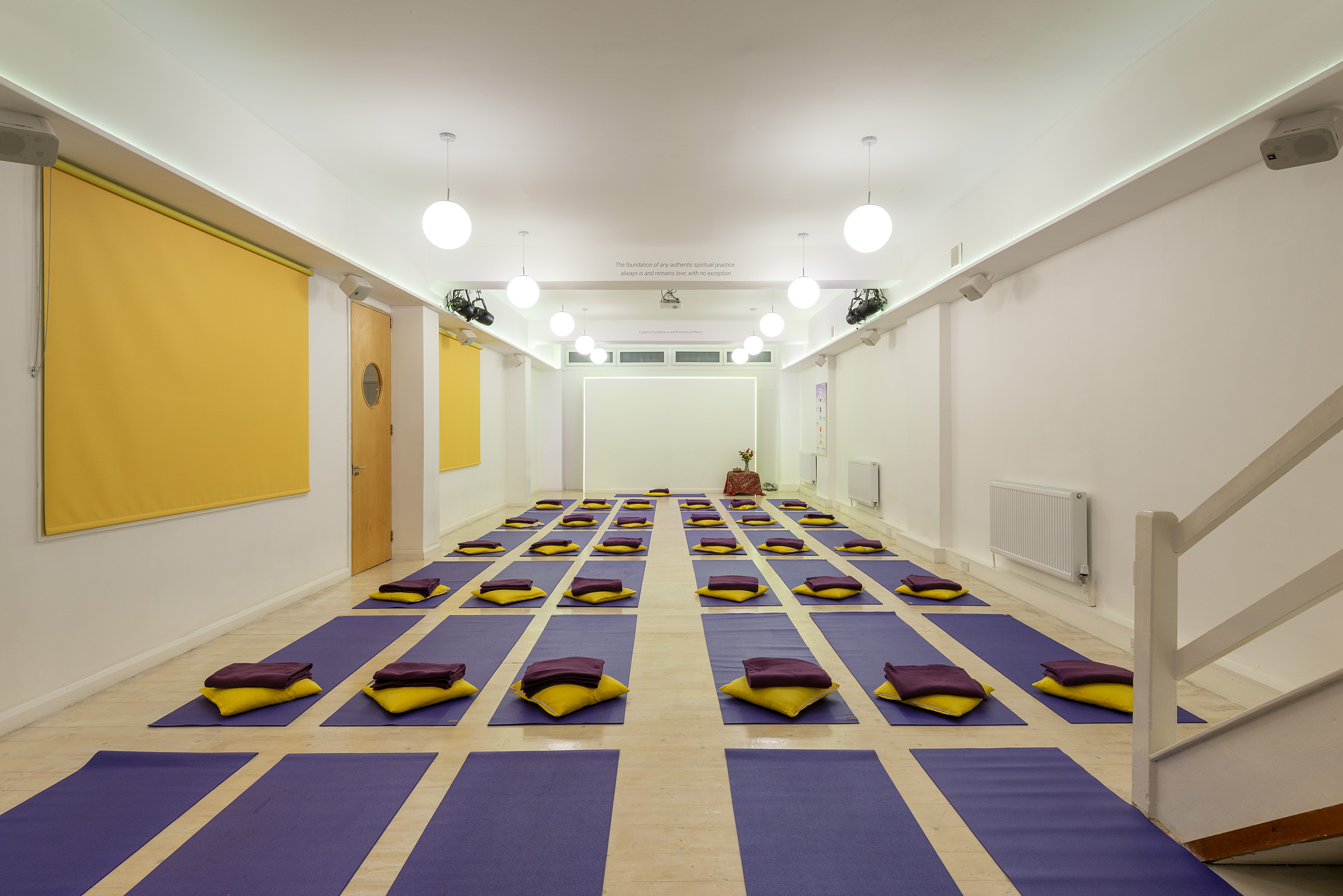 Serene yoga studio with mats for wellness retreat and mindfulness workshop.