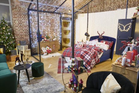 Filming a cozy holiday event at RSA House with a decorated Christmas tree.