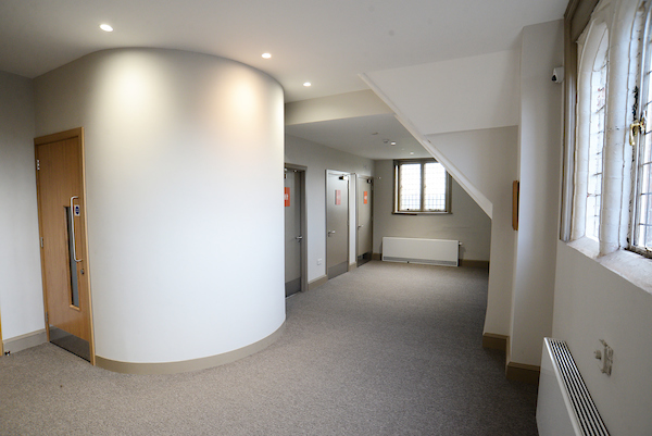 Well-lit corridor in Oxford House's Settlement Room, perfect for networking events.
