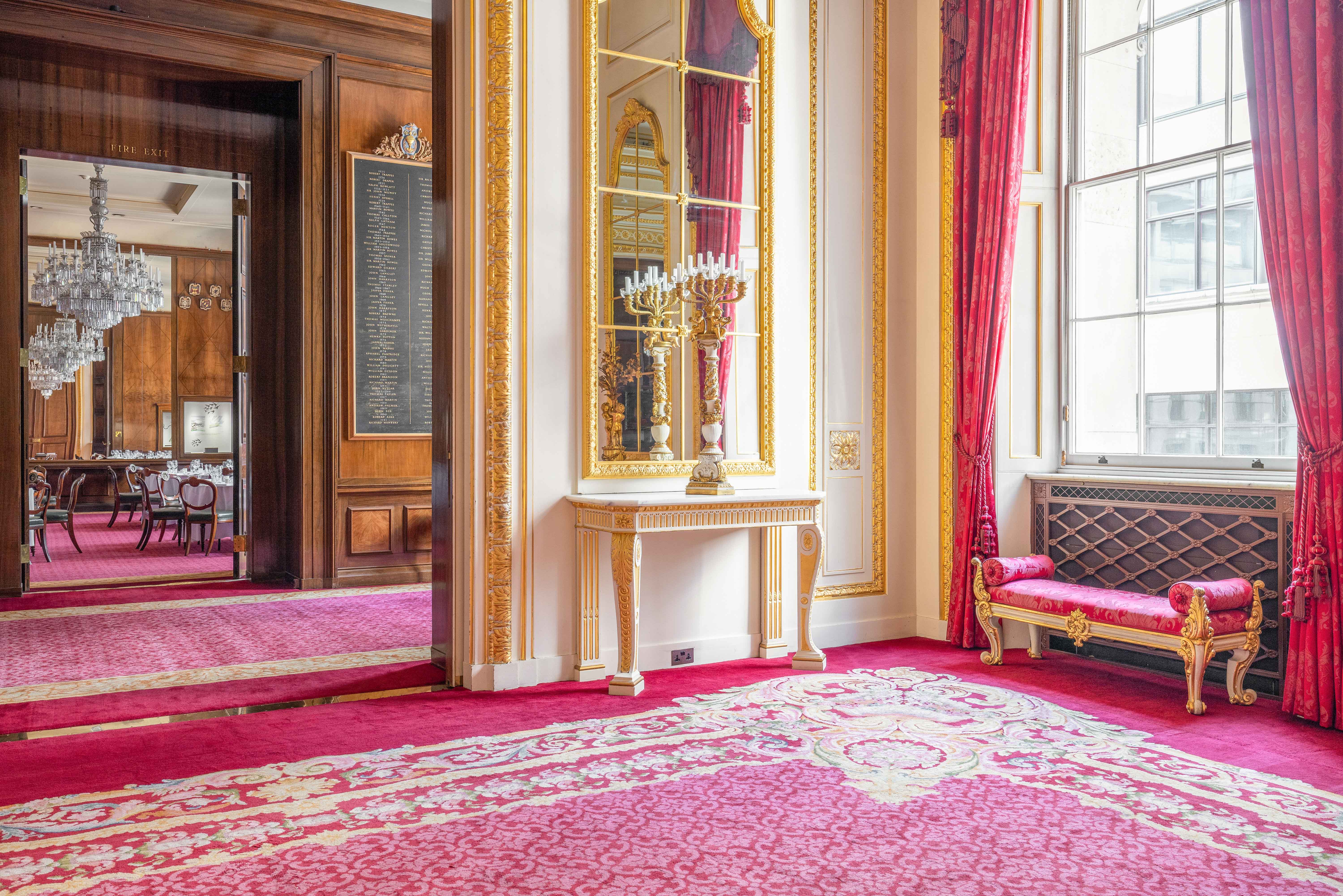 Elegant Drawing Room at Goldsmiths' Hall with rich red carpet, ideal for formal events.